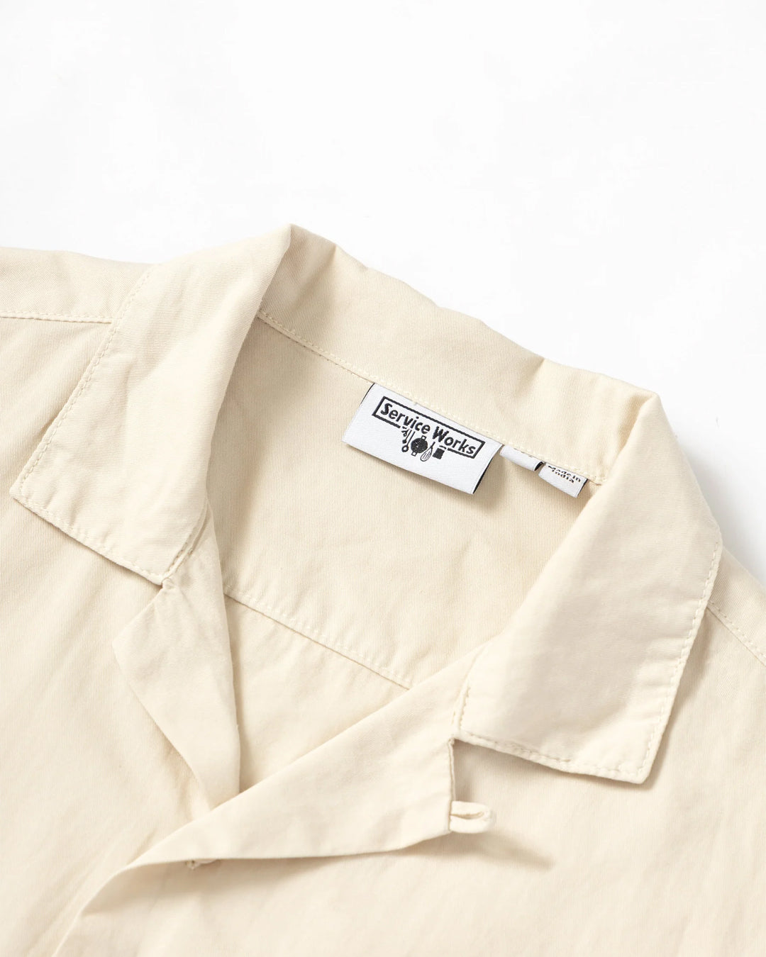 A Eckhaus Latta Shirt pictured on a model in front of a white background. The title of the product is Eckhaus Latta Eclipse Turtleneck - Stone and the image was taken by 199A®.