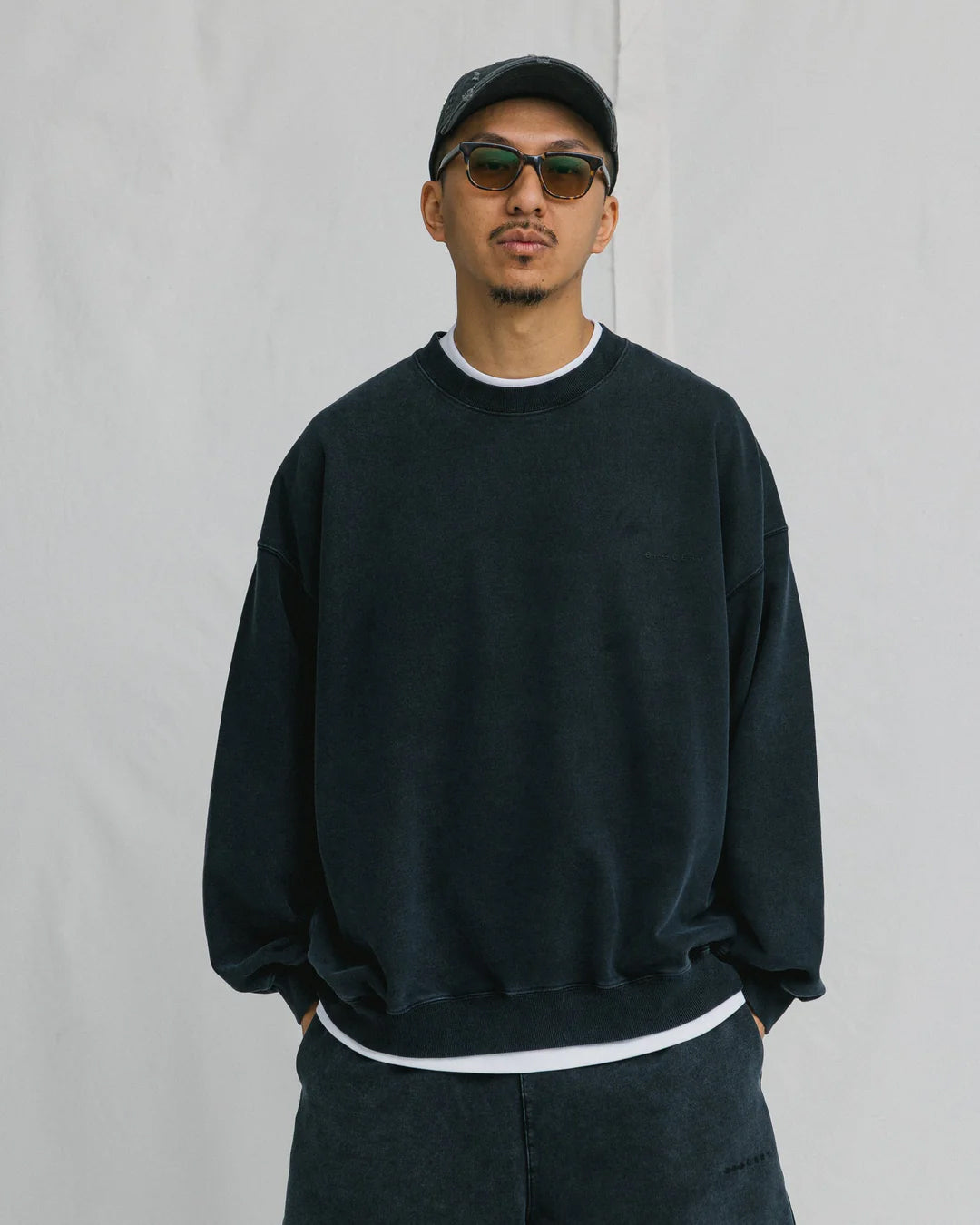 A Eckhaus Latta Shirt pictured on a model in front of a white background. The title of the product is Eckhaus Latta Eclipse Turtleneck - Stone and the image was taken by 199A®.