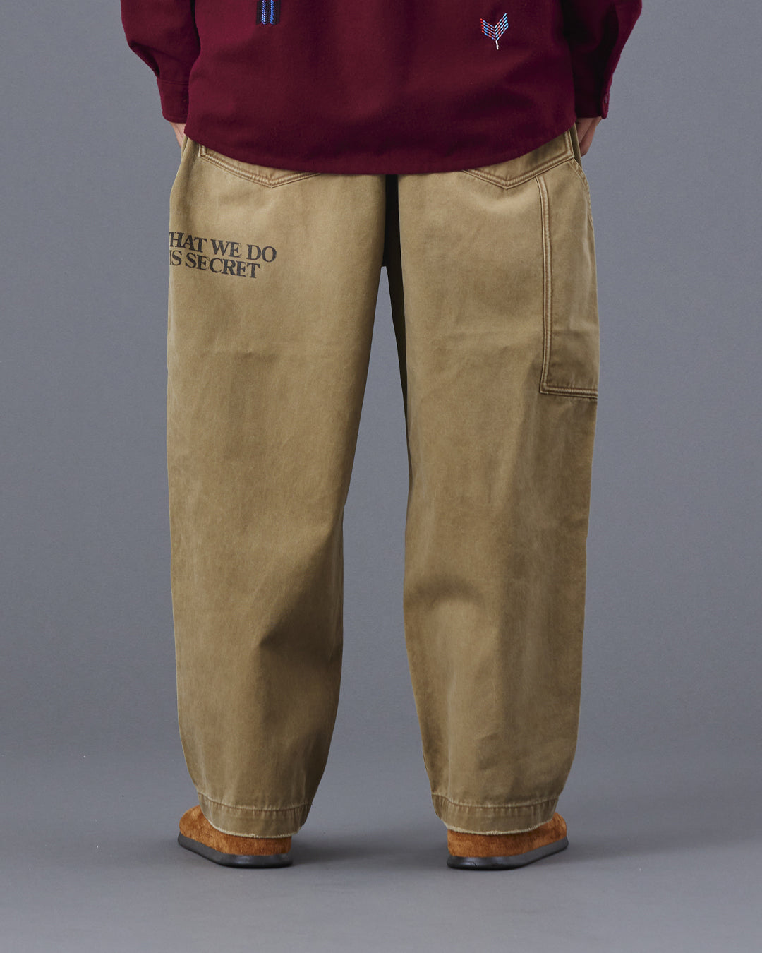 A Eckhaus Latta Shirt pictured on a model in front of a white background. The title of the product is Eckhaus Latta Eclipse Turtleneck - Stone and the image was taken by 199A®.