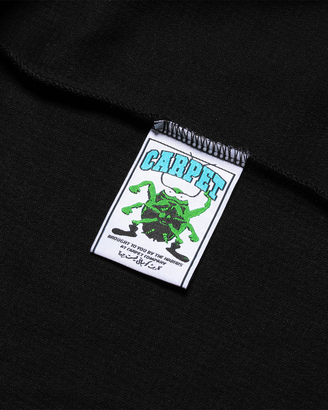 A Eckhaus Latta Shirt pictured on a model in front of a white background. The title of the product is Eckhaus Latta Eclipse Turtleneck - Stone and the image was taken by 199A®.