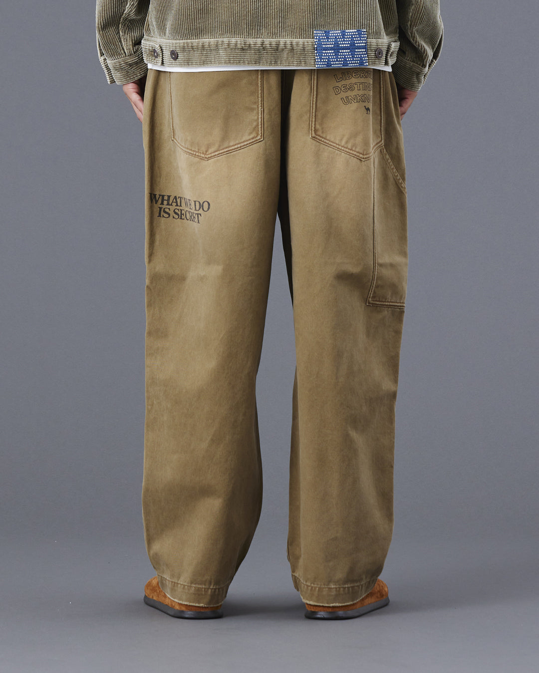 A Eckhaus Latta Shirt pictured on a model in front of a white background. The title of the product is Eckhaus Latta Eclipse Turtleneck - Stone and the image was taken by 199A®.