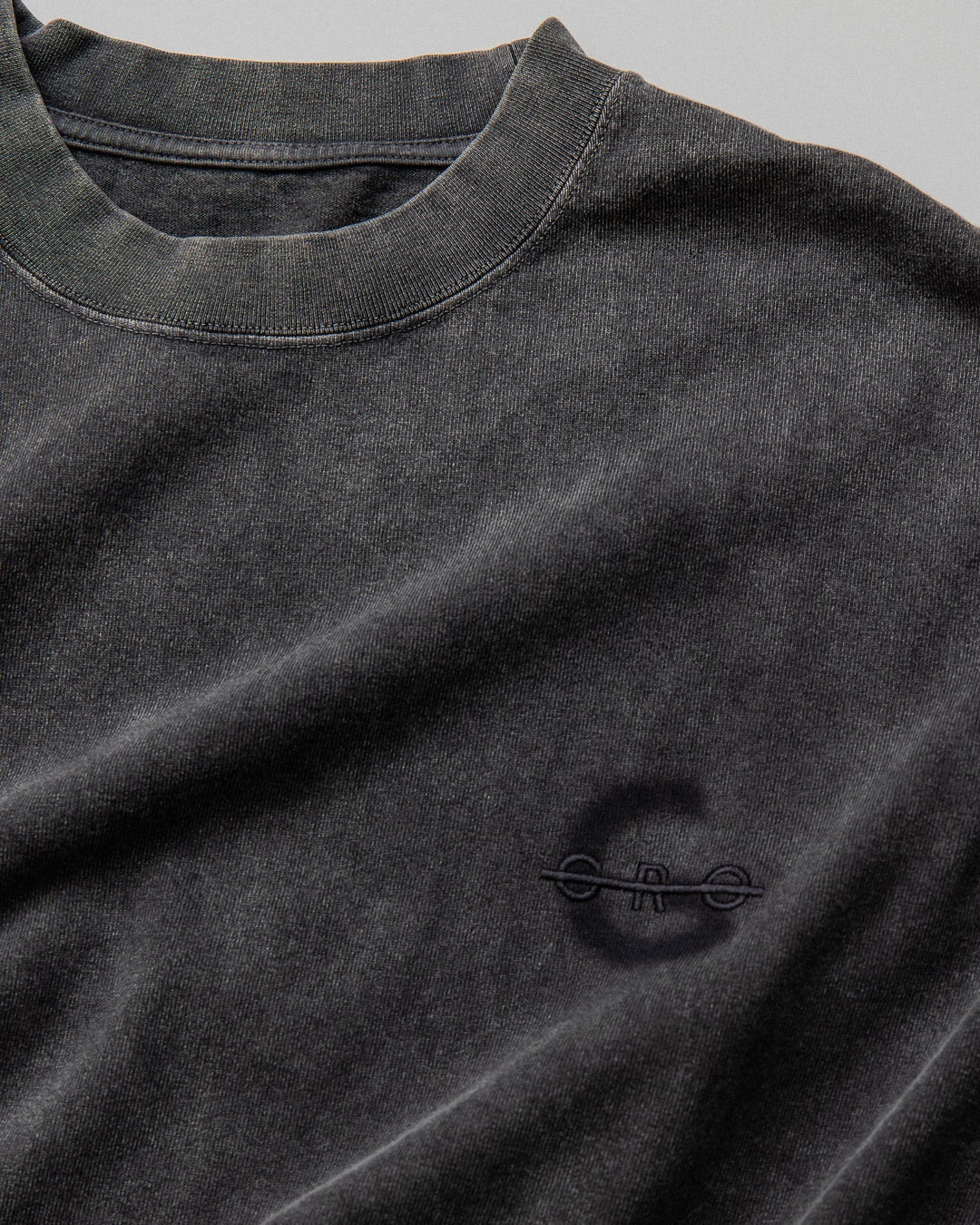 A Eckhaus Latta Shirt pictured on a model in front of a white background. The title of the product is Eckhaus Latta Eclipse Turtleneck - Stone and the image was taken by 199A®.