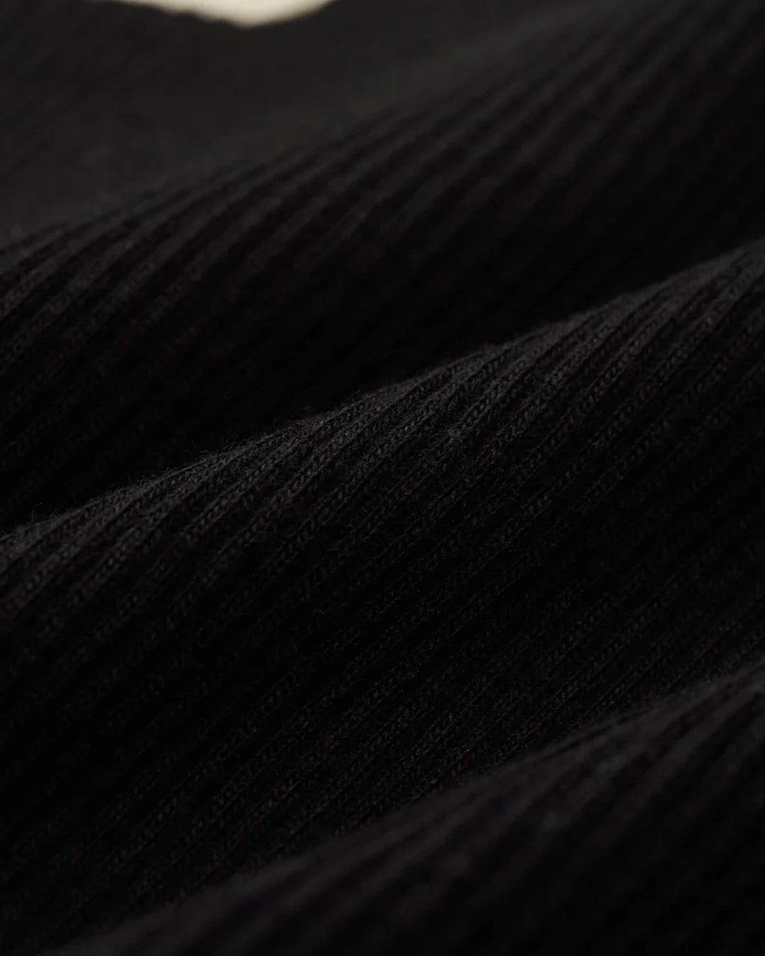 A Eckhaus Latta Shirt pictured on a model in front of a white background. The title of the product is Eckhaus Latta Eclipse Turtleneck - Stone and the image was taken by 199A®.