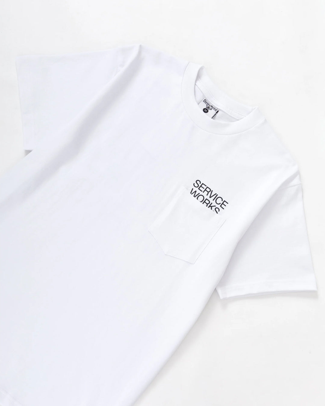 A Eckhaus Latta Shirt pictured on a model in front of a white background. The title of the product is Eckhaus Latta Eclipse Turtleneck - Stone and the image was taken by 199A®.