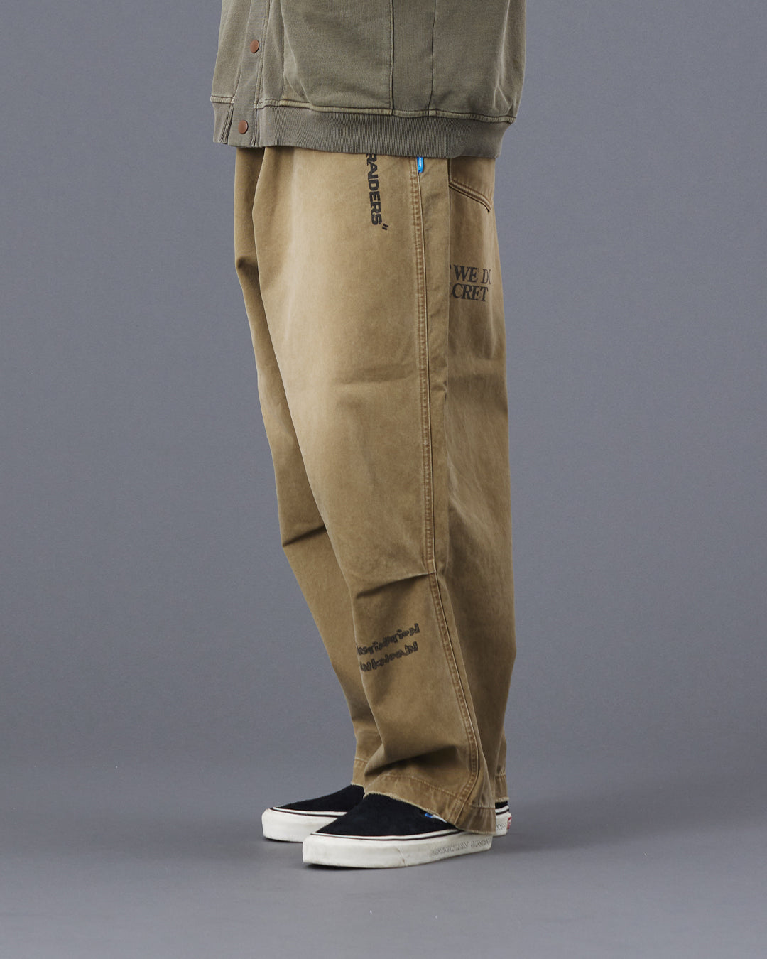 A Eckhaus Latta Shirt pictured on a model in front of a white background. The title of the product is Eckhaus Latta Eclipse Turtleneck - Stone and the image was taken by 199A®.