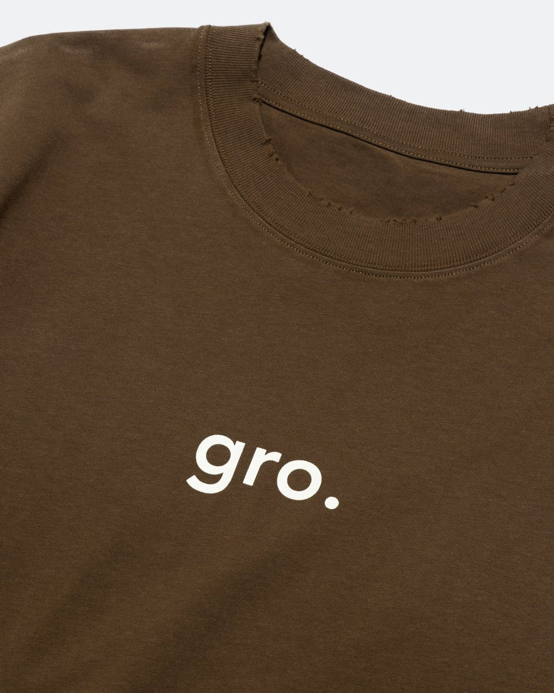 A Eckhaus Latta Shirt pictured on a model in front of a white background. The title of the product is Eckhaus Latta Eclipse Turtleneck - Stone and the image was taken by 199A®.