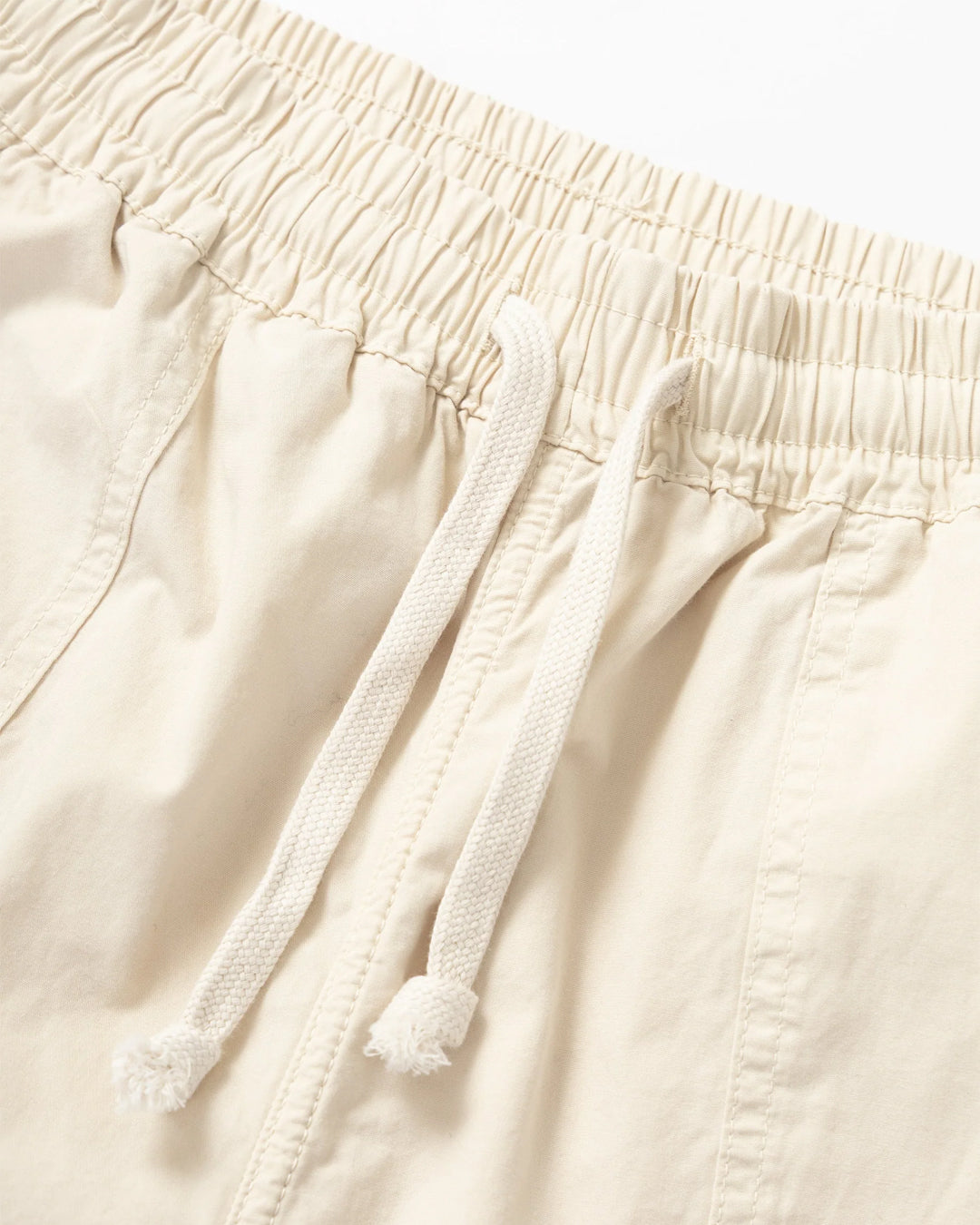 A Eckhaus Latta Shirt pictured on a model in front of a white background. The title of the product is Eckhaus Latta Eclipse Turtleneck - Stone and the image was taken by 199A®.