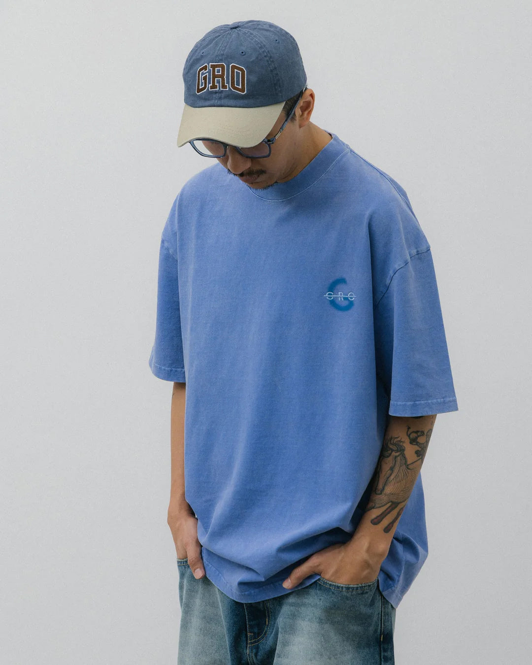 A Eckhaus Latta Shirt pictured on a model in front of a white background. The title of the product is Eckhaus Latta Eclipse Turtleneck - Stone and the image was taken by 199A®.