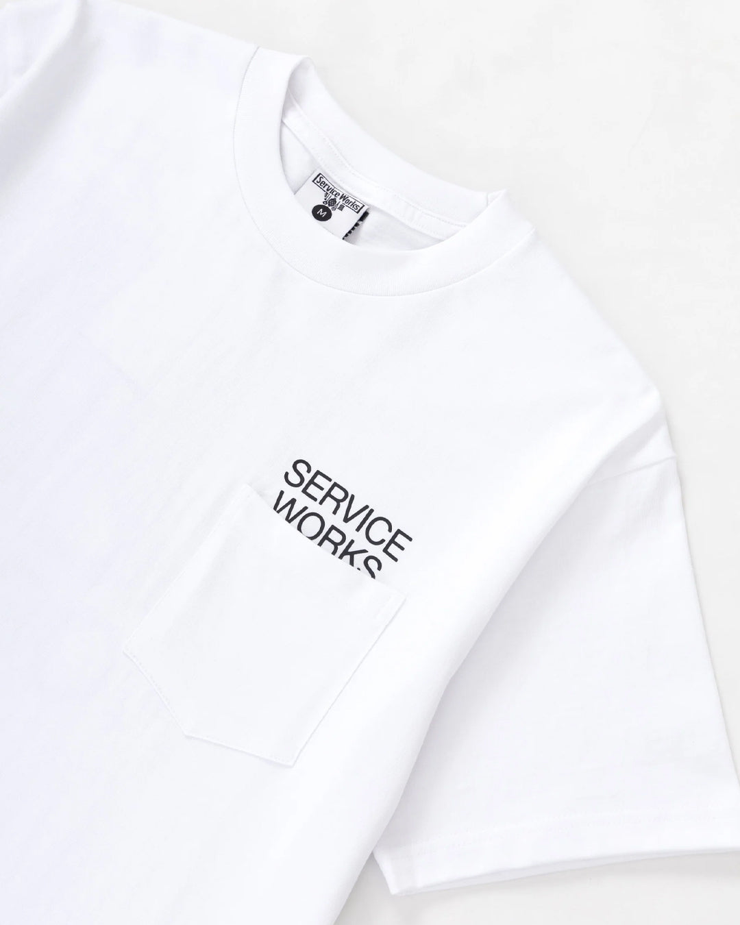 A Eckhaus Latta Shirt pictured on a model in front of a white background. The title of the product is Eckhaus Latta Eclipse Turtleneck - Stone and the image was taken by 199A®.
