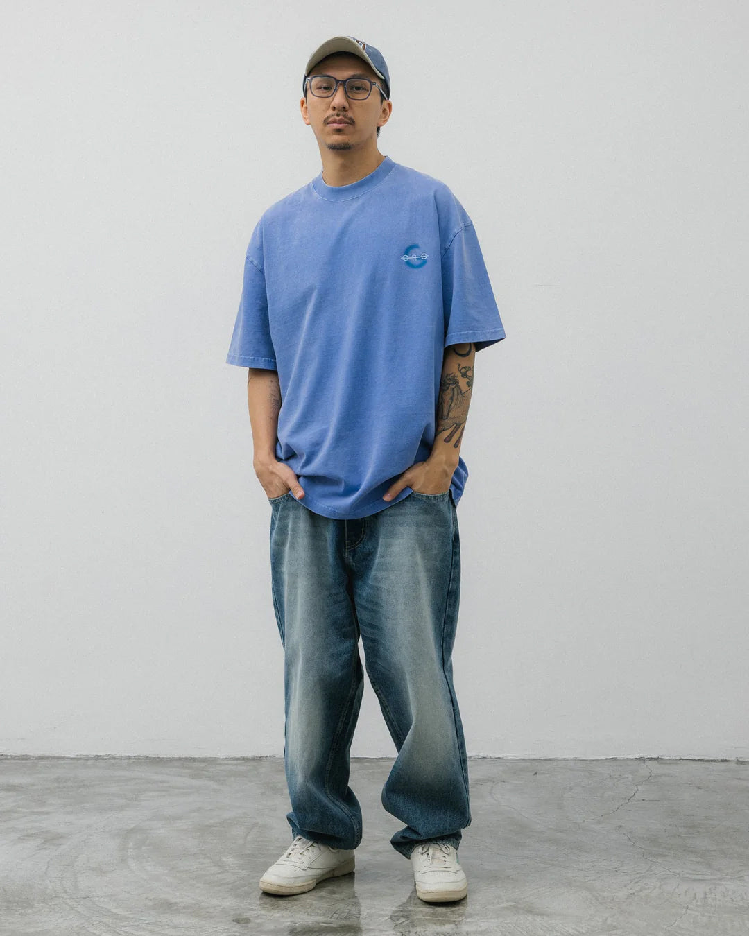 A Eckhaus Latta Shirt pictured on a model in front of a white background. The title of the product is Eckhaus Latta Eclipse Turtleneck - Stone and the image was taken by 199A®.