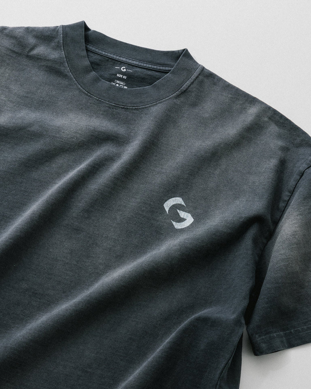 A Eckhaus Latta Shirt pictured on a model in front of a white background. The title of the product is Eckhaus Latta Eclipse Turtleneck - Stone and the image was taken by 199A®.