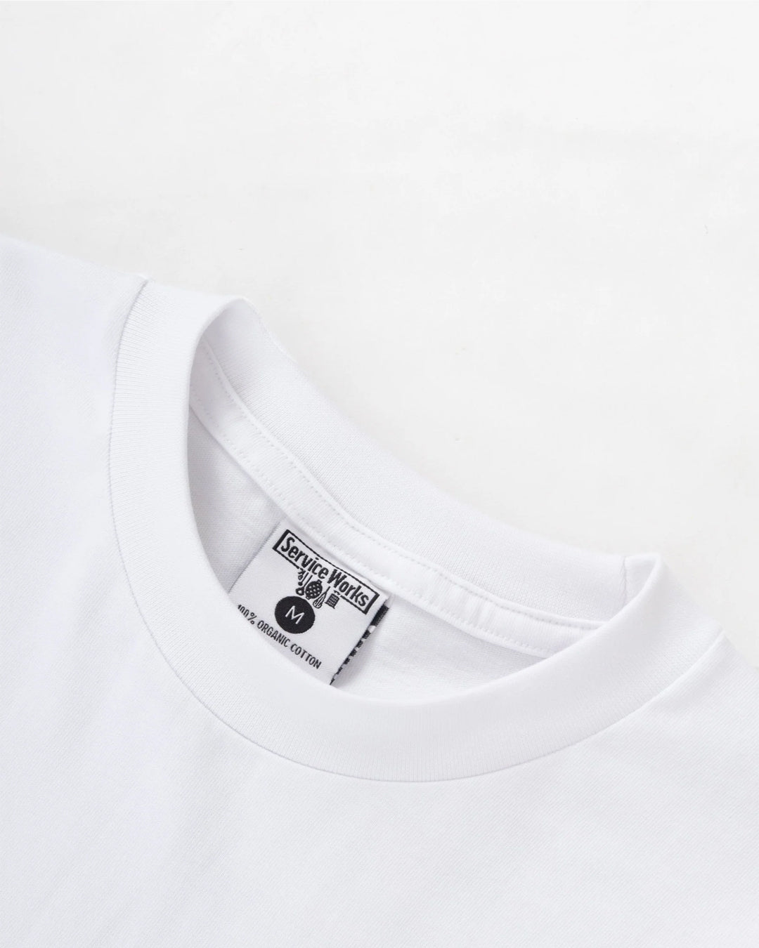 A Eckhaus Latta Shirt pictured on a model in front of a white background. The title of the product is Eckhaus Latta Eclipse Turtleneck - Stone and the image was taken by 199A®.