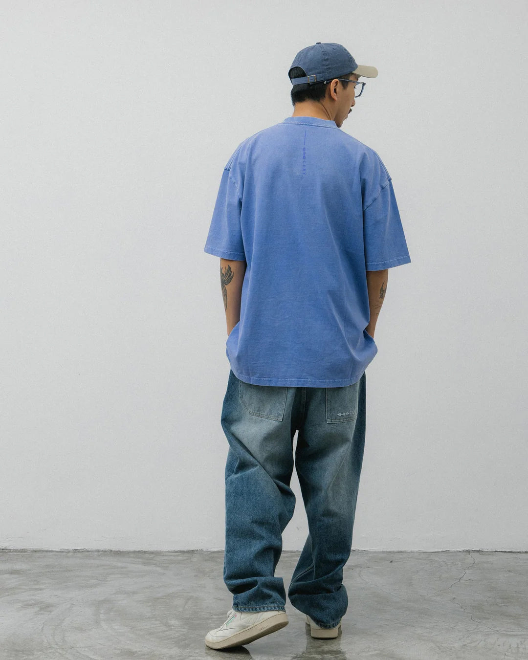 A Eckhaus Latta Shirt pictured on a model in front of a white background. The title of the product is Eckhaus Latta Eclipse Turtleneck - Stone and the image was taken by 199A®.