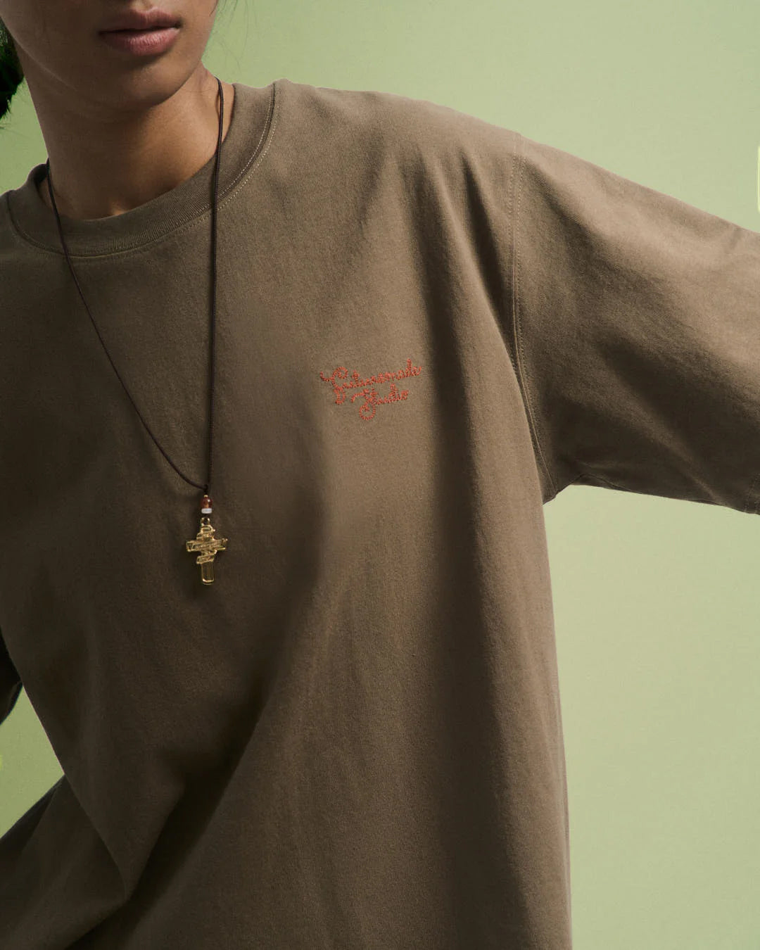 A Eckhaus Latta Shirt pictured on a model in front of a white background. The title of the product is Eckhaus Latta Eclipse Turtleneck - Stone and the image was taken by 199A®.