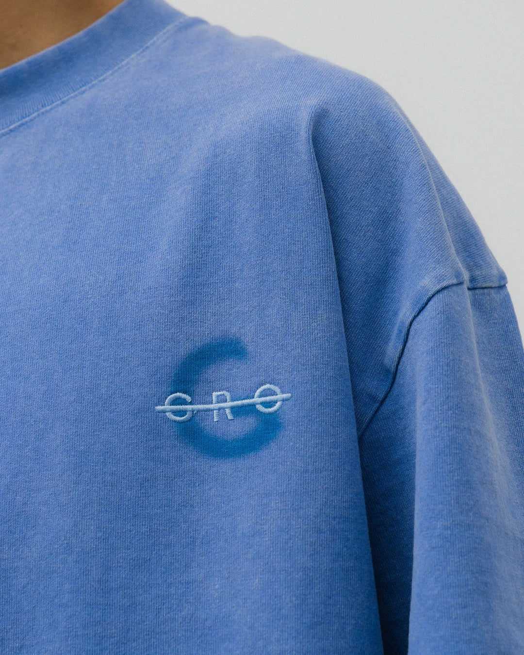 A Eckhaus Latta Shirt pictured on a model in front of a white background. The title of the product is Eckhaus Latta Eclipse Turtleneck - Stone and the image was taken by 199A®.