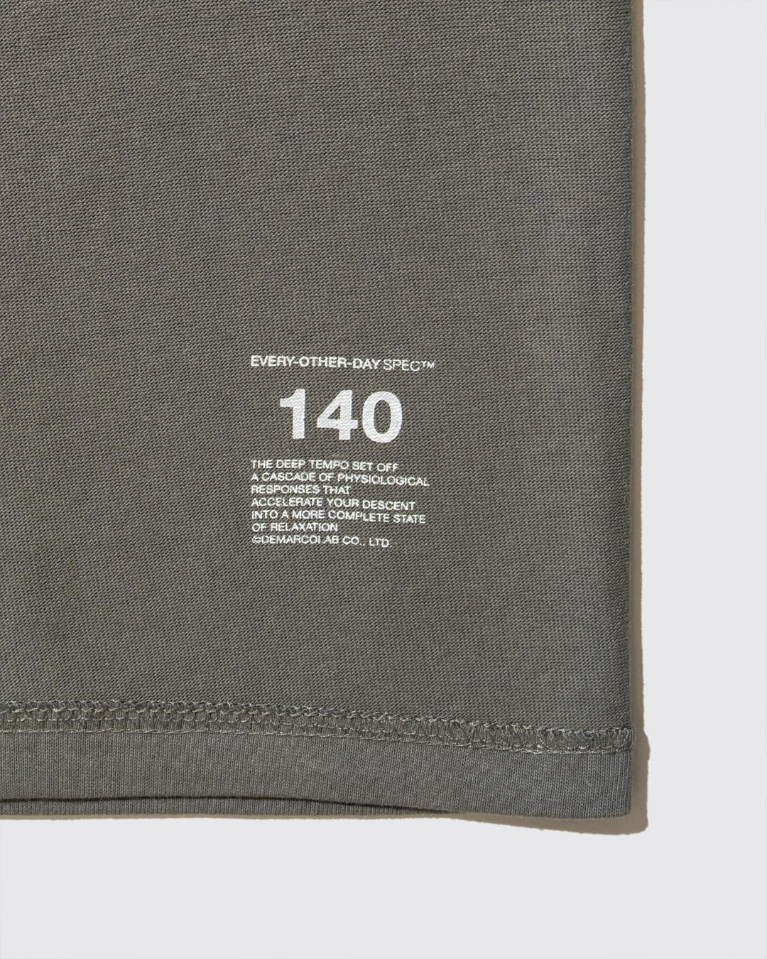 A Eckhaus Latta Shirt pictured on a model in front of a white background. The title of the product is Eckhaus Latta Eclipse Turtleneck - Stone and the image was taken by 199A®.
