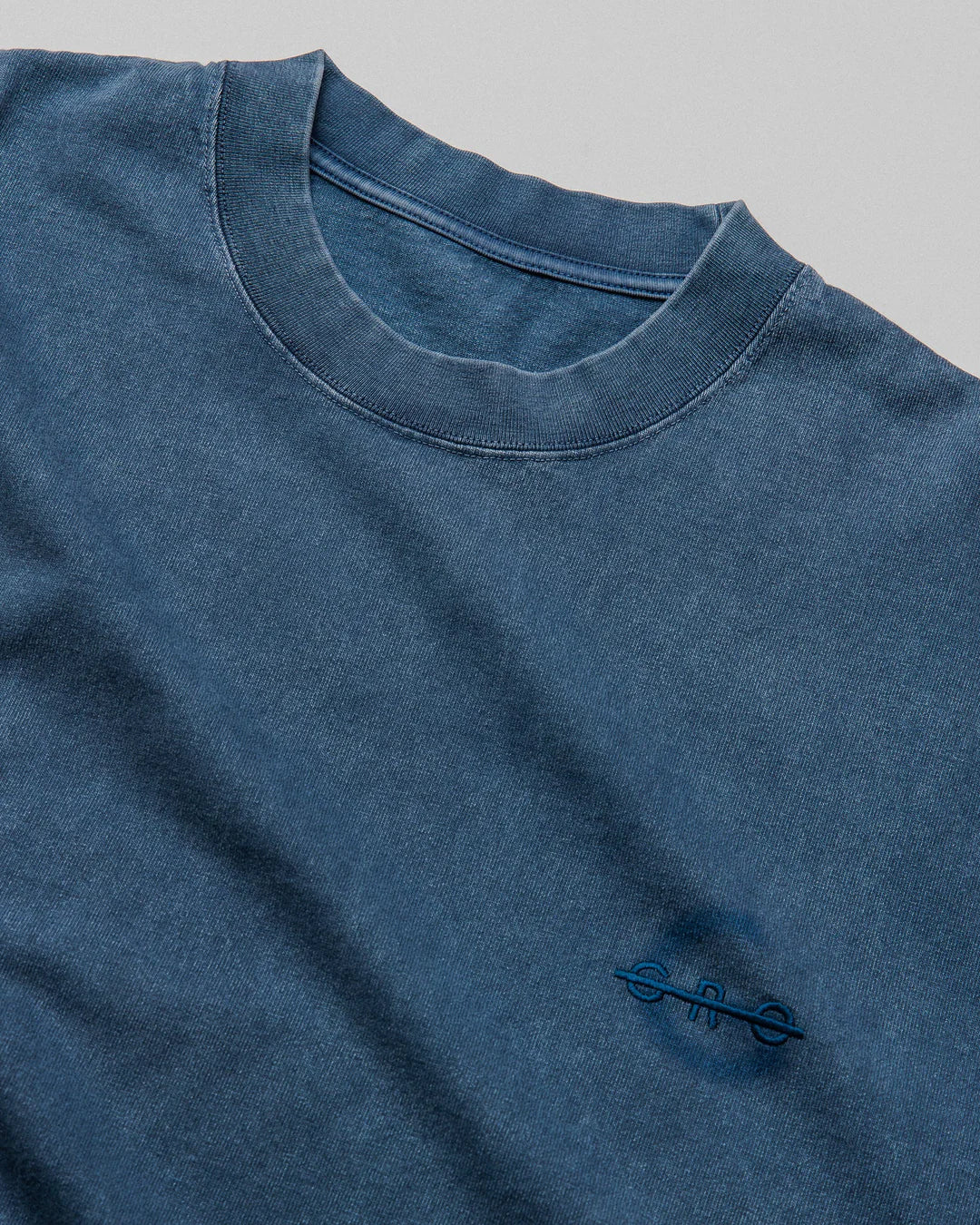 A Eckhaus Latta Shirt pictured on a model in front of a white background. The title of the product is Eckhaus Latta Eclipse Turtleneck - Stone and the image was taken by 199A®.