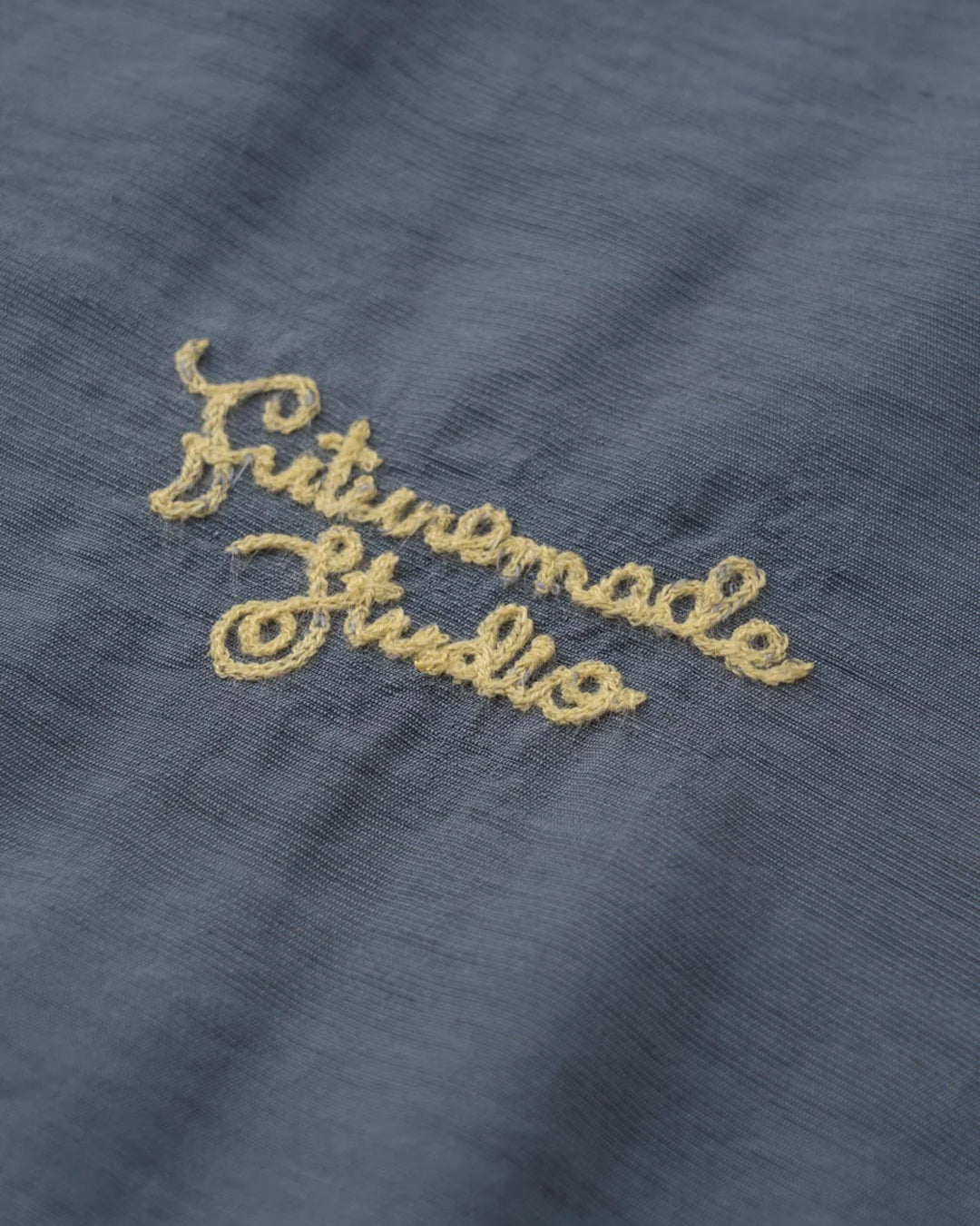 A Eckhaus Latta Shirt pictured on a model in front of a white background. The title of the product is Eckhaus Latta Eclipse Turtleneck - Stone and the image was taken by 199A®.