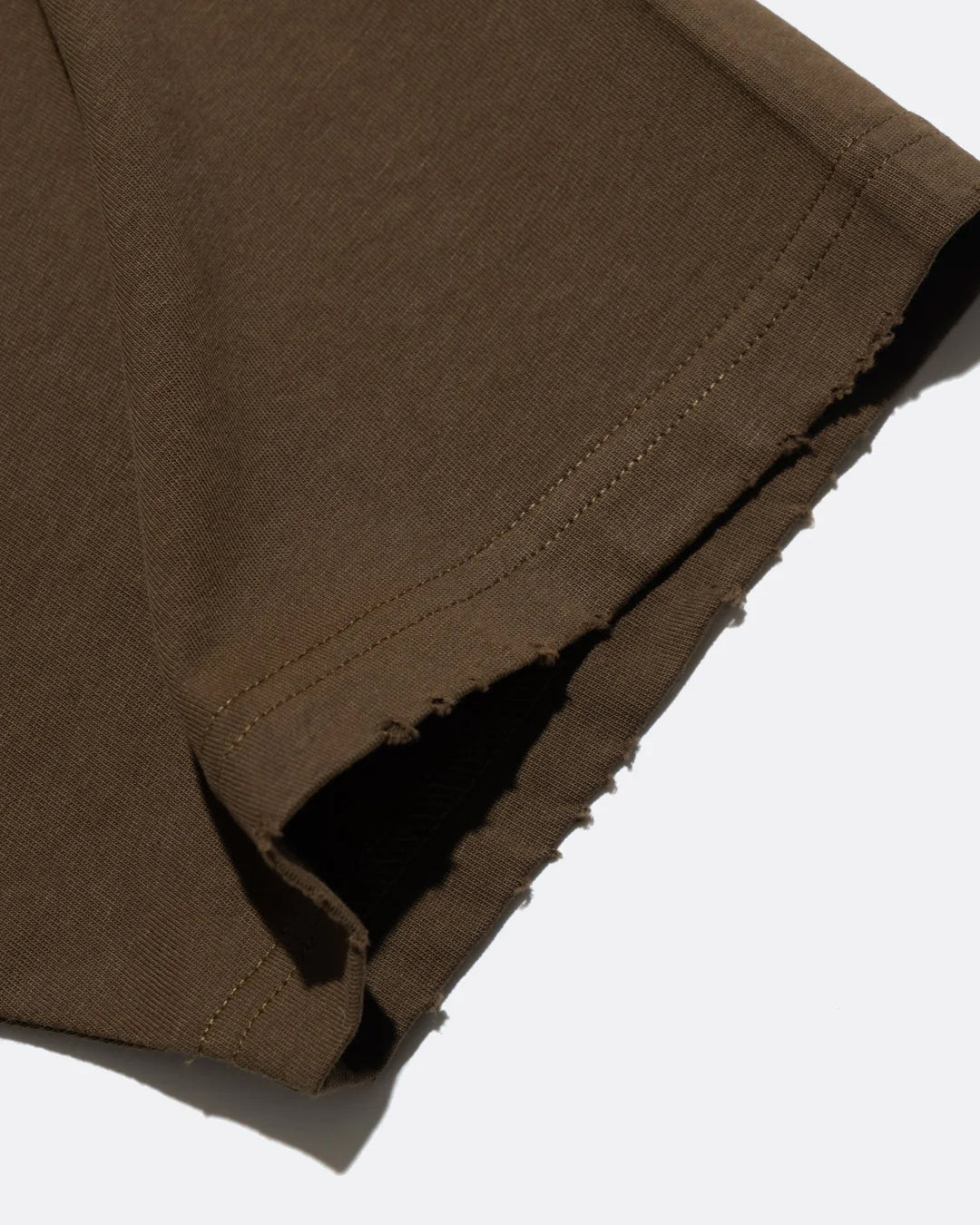 A Eckhaus Latta Shirt pictured on a model in front of a white background. The title of the product is Eckhaus Latta Eclipse Turtleneck - Stone and the image was taken by 199A®.