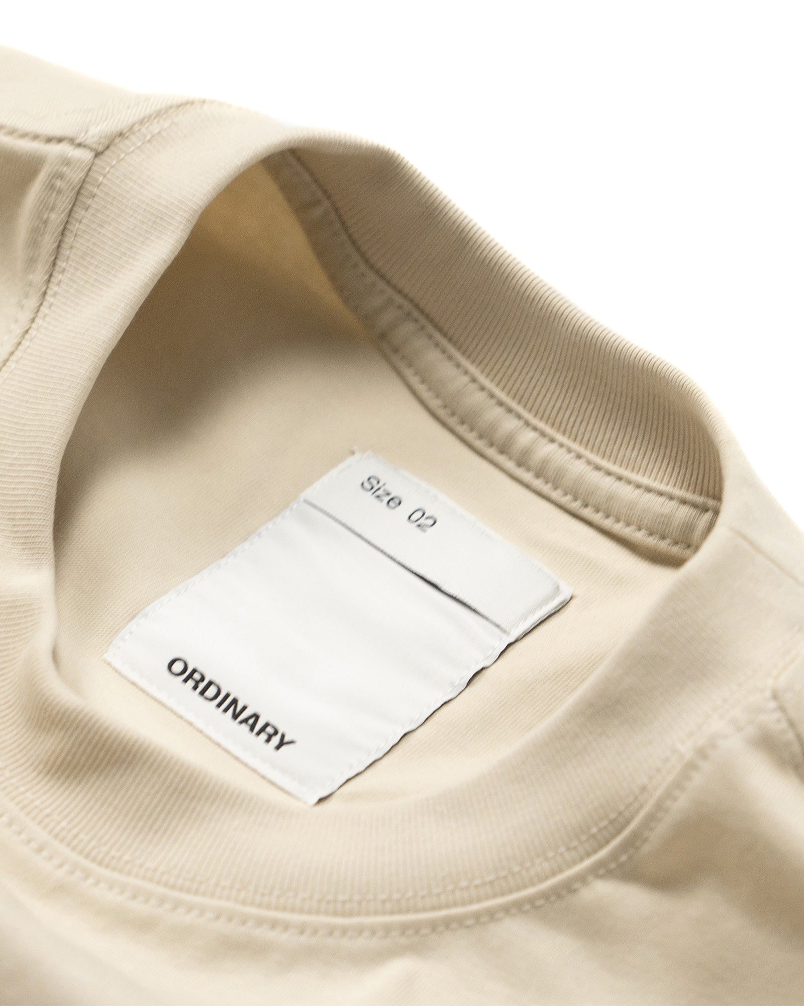 A Eckhaus Latta Shirt pictured on a model in front of a white background. The title of the product is Eckhaus Latta Eclipse Turtleneck - Stone and the image was taken by 199A®.