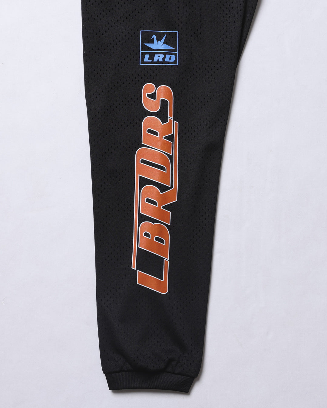 A Eckhaus Latta Shirt pictured on a model in front of a white background. The title of the product is Eckhaus Latta Eclipse Turtleneck - Stone and the image was taken by 199A®.