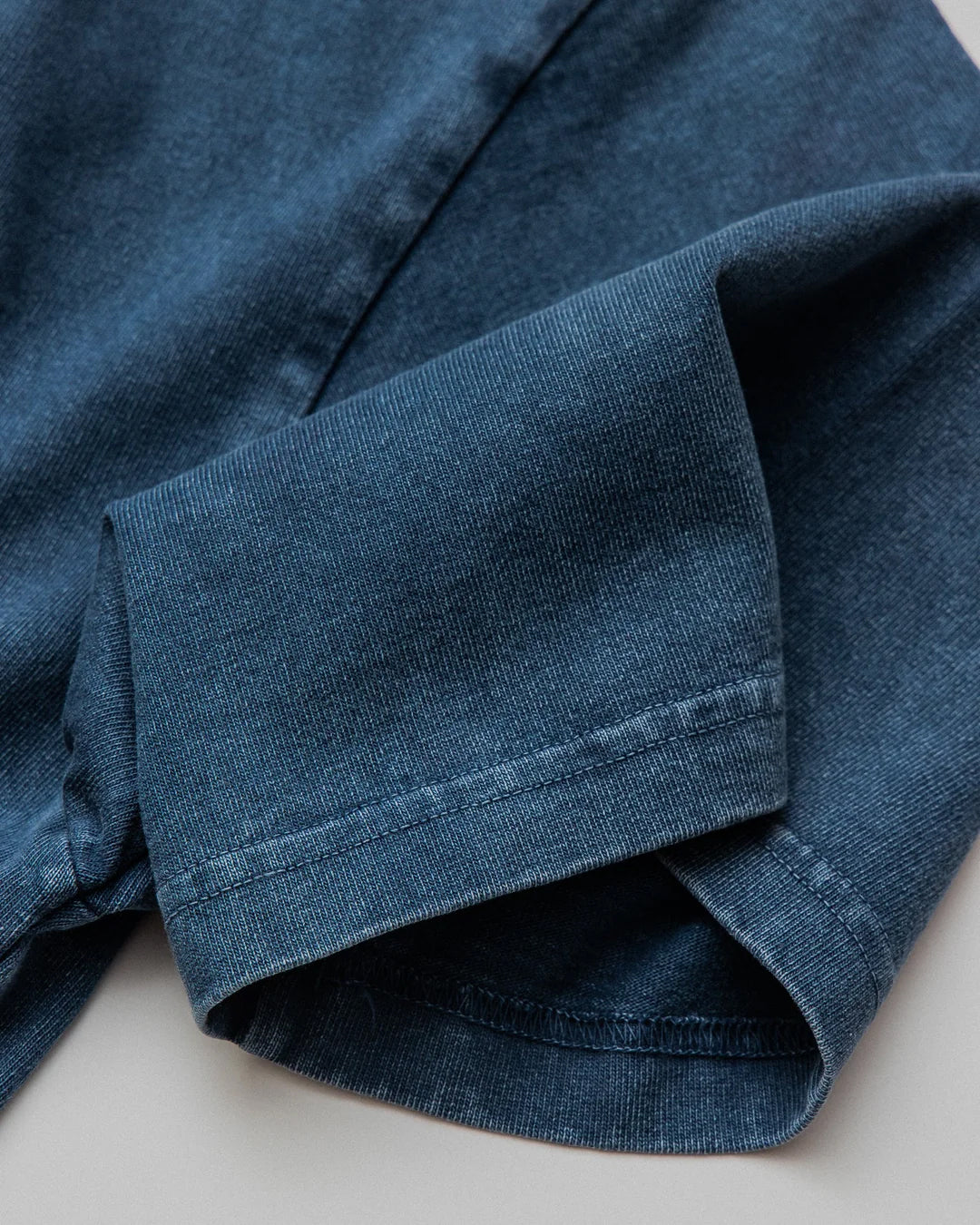 A Eckhaus Latta Shirt pictured on a model in front of a white background. The title of the product is Eckhaus Latta Eclipse Turtleneck - Stone and the image was taken by 199A®.