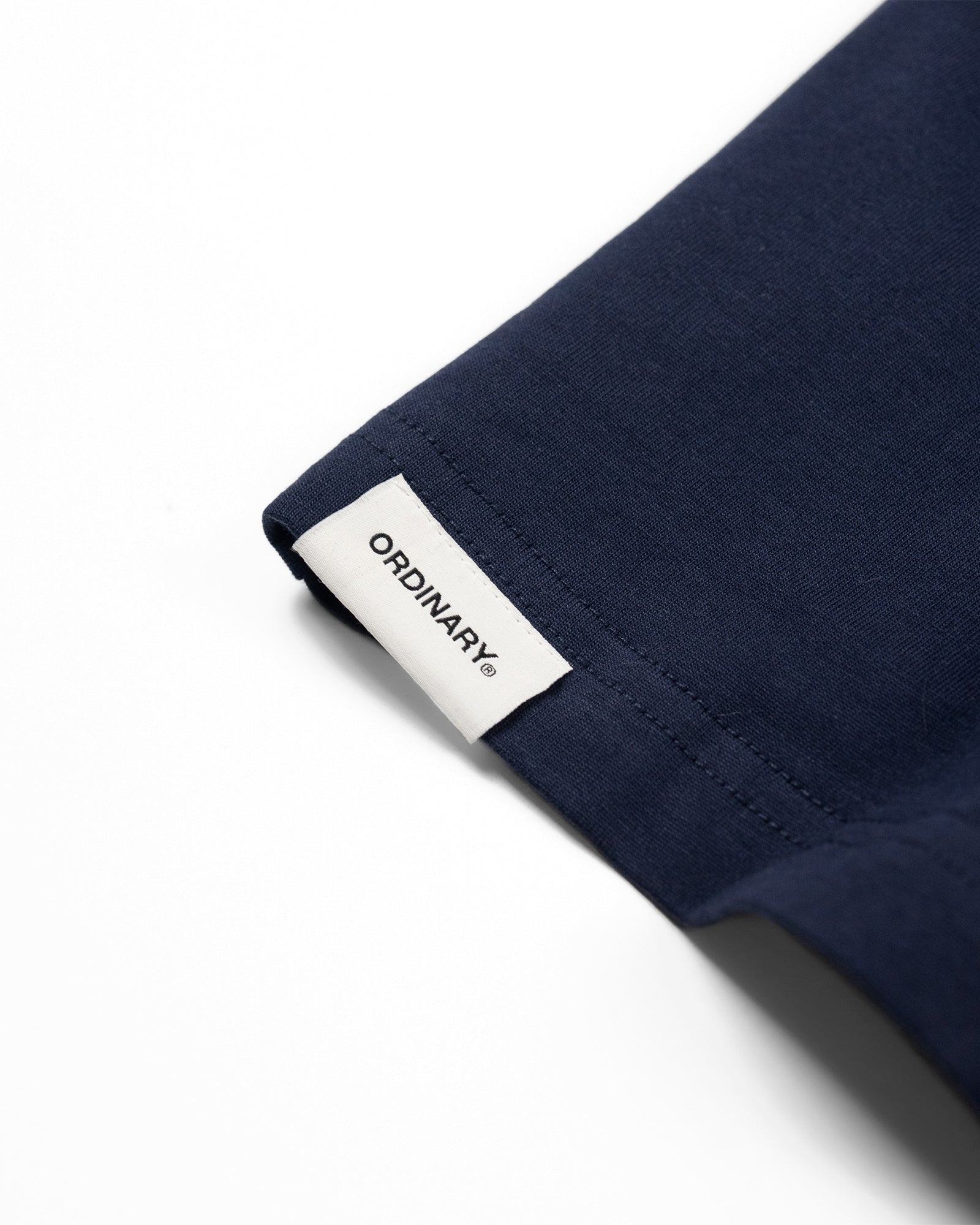 A Eckhaus Latta Shirt pictured on a model in front of a white background. The title of the product is Eckhaus Latta Eclipse Turtleneck - Stone and the image was taken by 199A®.