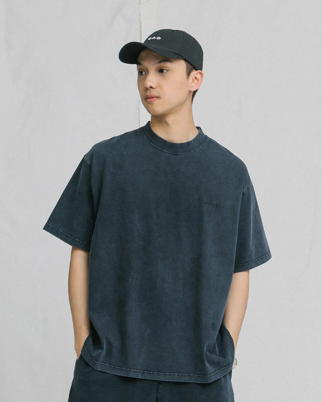 A Eckhaus Latta Shirt pictured on a model in front of a white background. The title of the product is Eckhaus Latta Eclipse Turtleneck - Stone and the image was taken by 199A®.