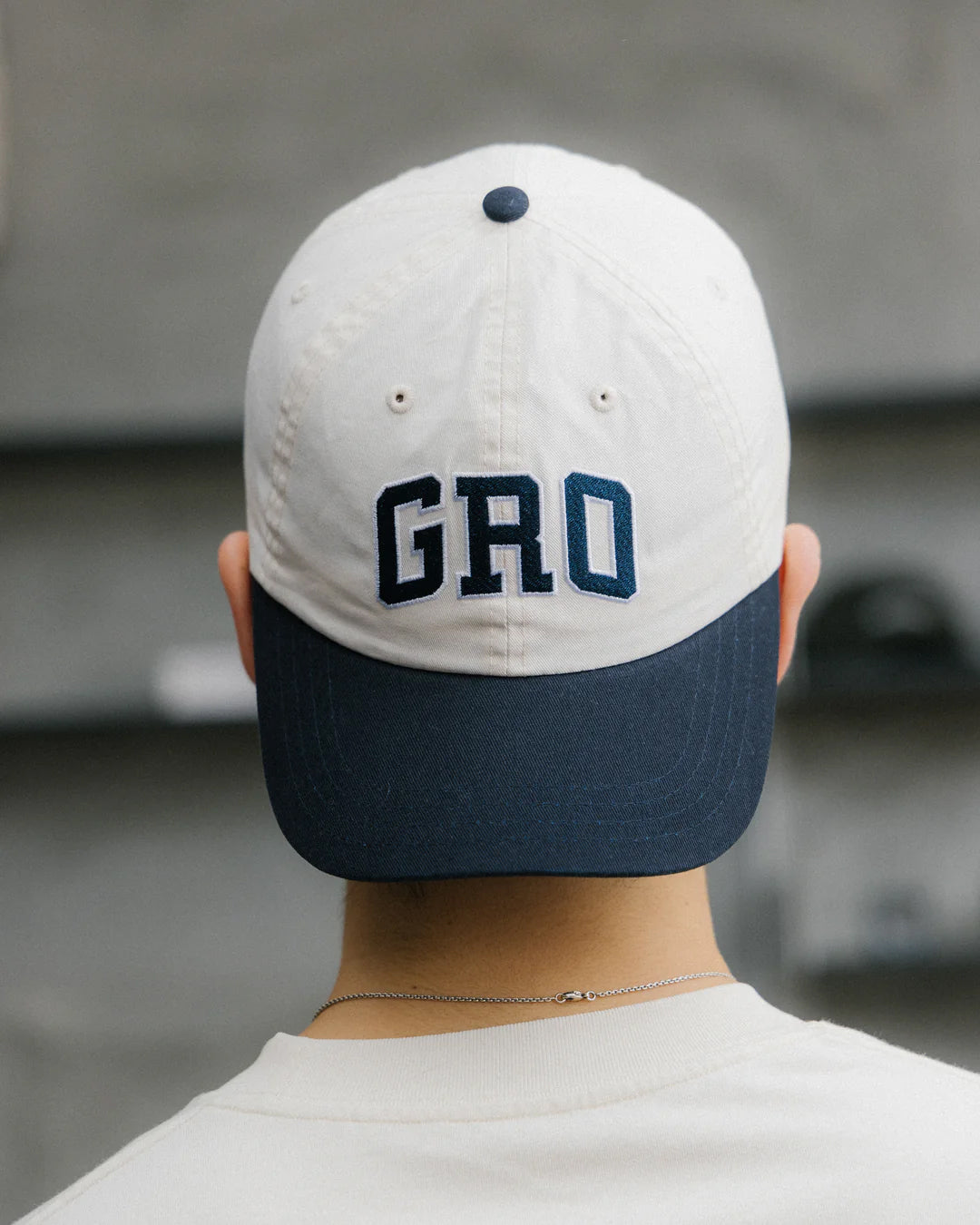 A Eckhaus Latta Shirt pictured on a model in front of a white background. The title of the product is Eckhaus Latta Eclipse Turtleneck - Stone and the image was taken by 199A®.