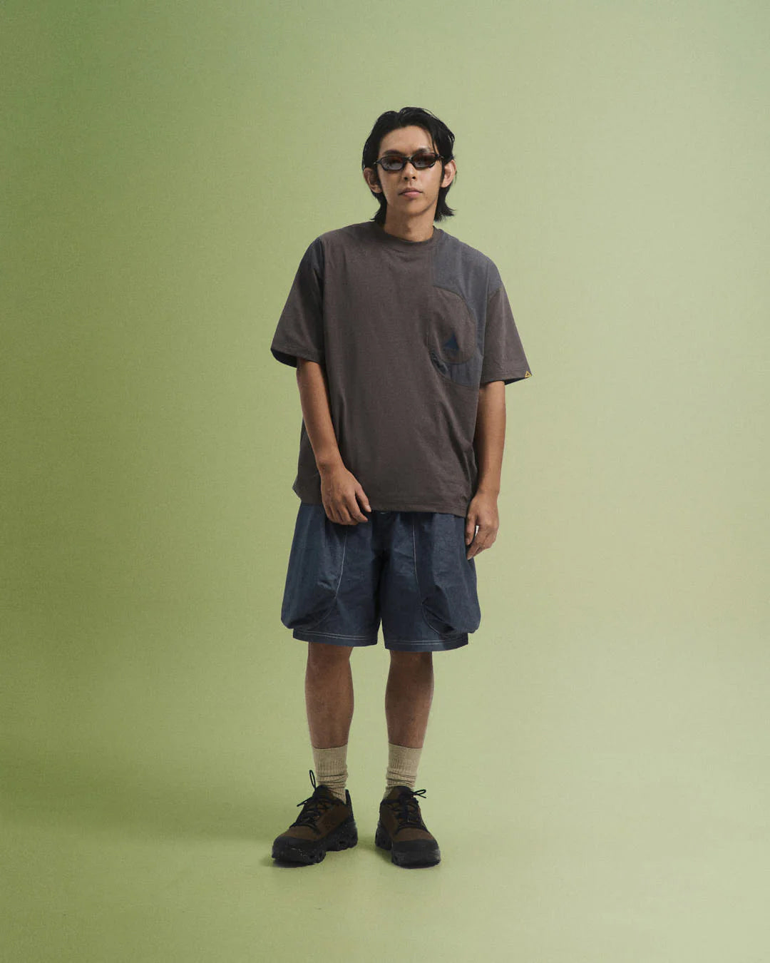 A Eckhaus Latta Shirt pictured on a model in front of a white background. The title of the product is Eckhaus Latta Eclipse Turtleneck - Stone and the image was taken by 199A®.