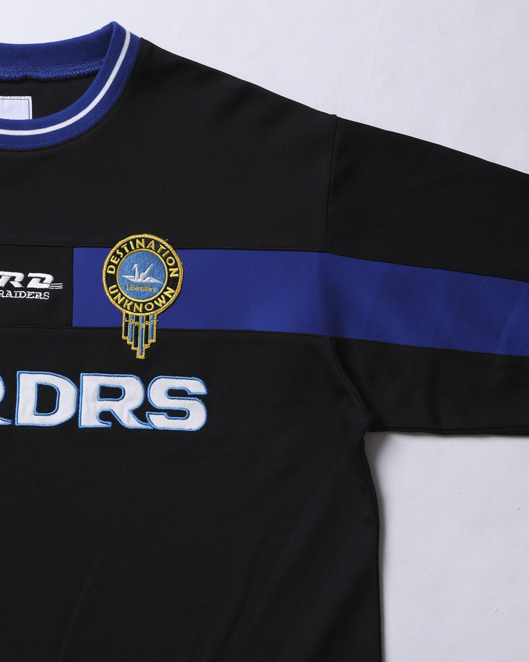 A Eckhaus Latta Shirt pictured on a model in front of a white background. The title of the product is Eckhaus Latta Eclipse Turtleneck - Stone and the image was taken by 199A®.