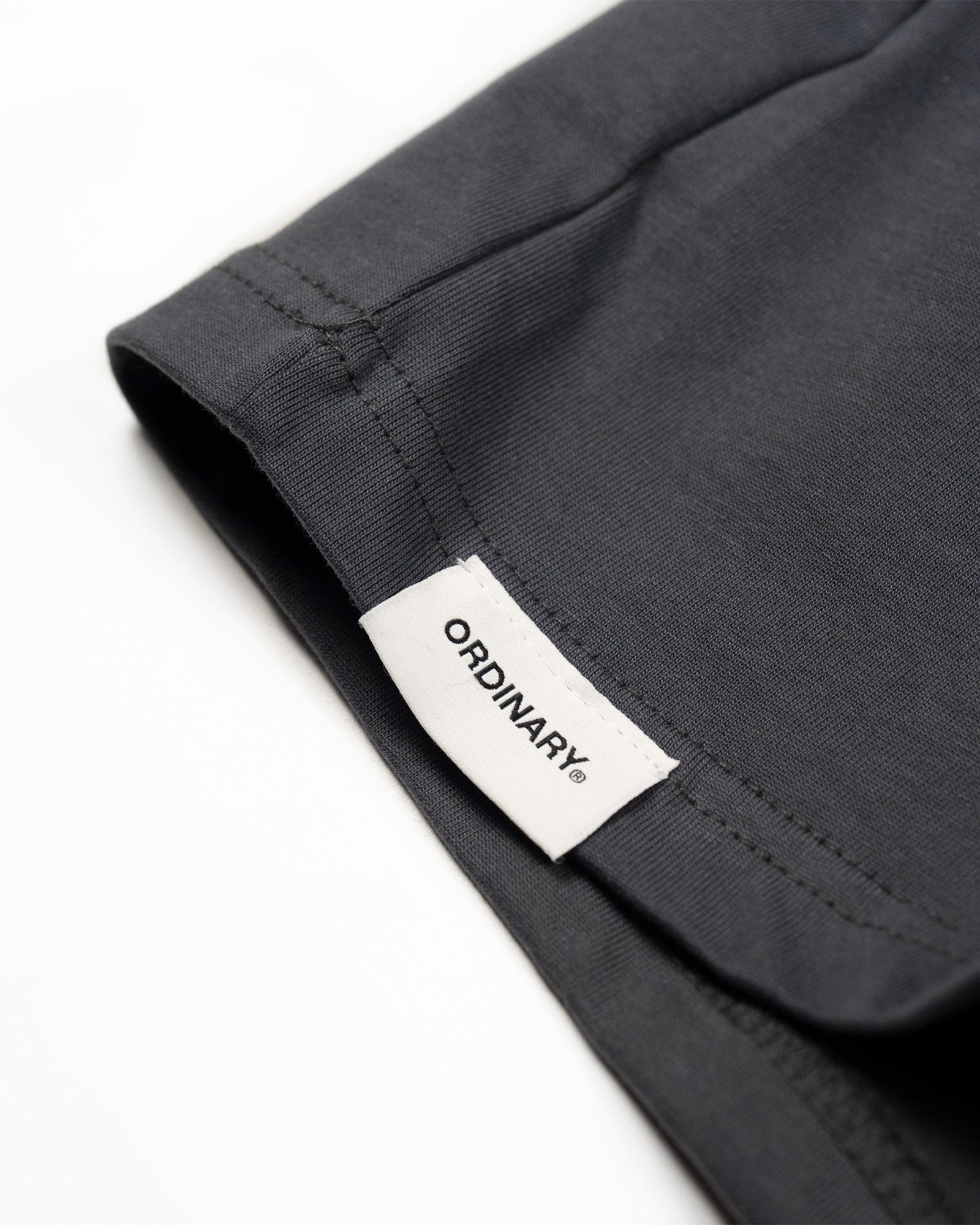 A Eckhaus Latta Shirt pictured on a model in front of a white background. The title of the product is Eckhaus Latta Eclipse Turtleneck - Stone and the image was taken by 199A®.