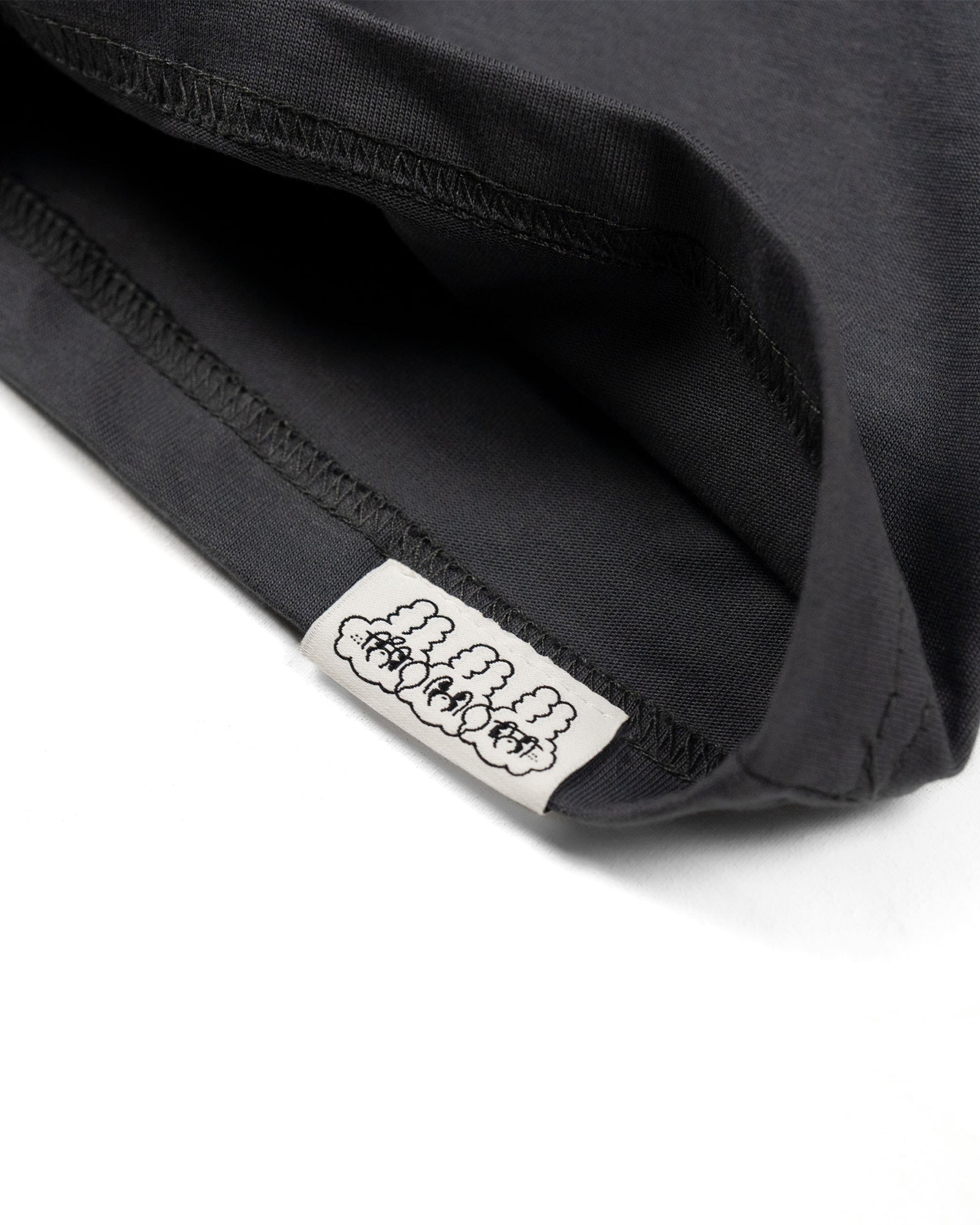 A Eckhaus Latta Shirt pictured on a model in front of a white background. The title of the product is Eckhaus Latta Eclipse Turtleneck - Stone and the image was taken by 199A®.