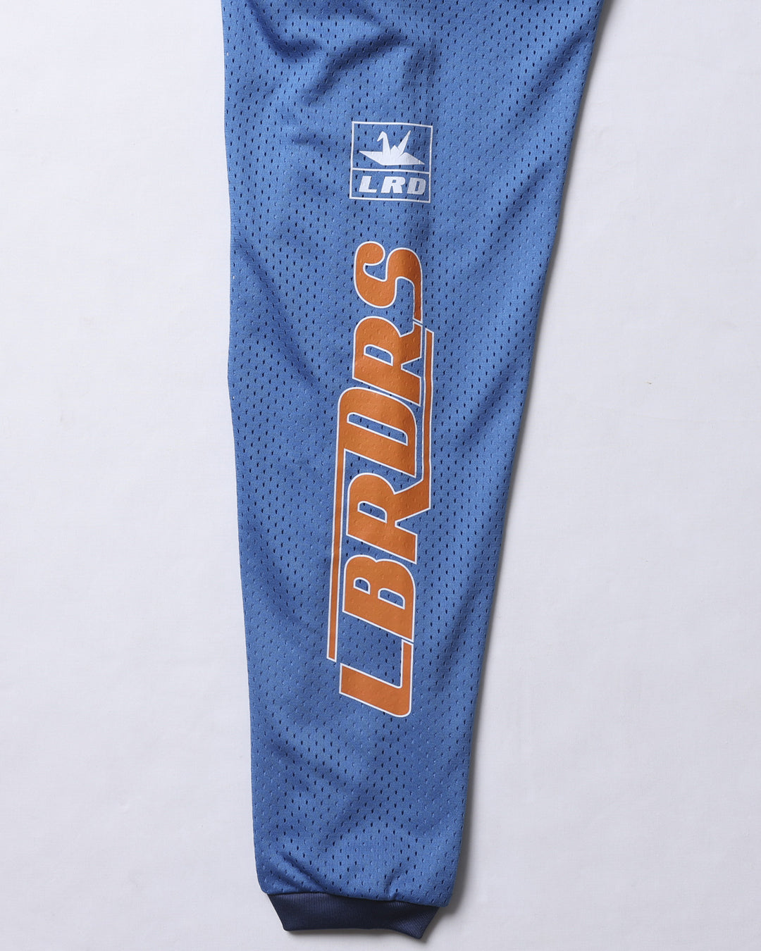 A Eckhaus Latta Shirt pictured on a model in front of a white background. The title of the product is Eckhaus Latta Eclipse Turtleneck - Stone and the image was taken by 199A®.