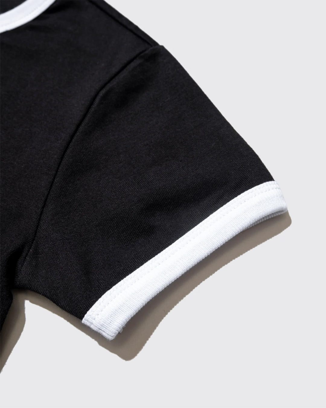 A Eckhaus Latta Shirt pictured on a model in front of a white background. The title of the product is Eckhaus Latta Eclipse Turtleneck - Stone and the image was taken by 199A®.
