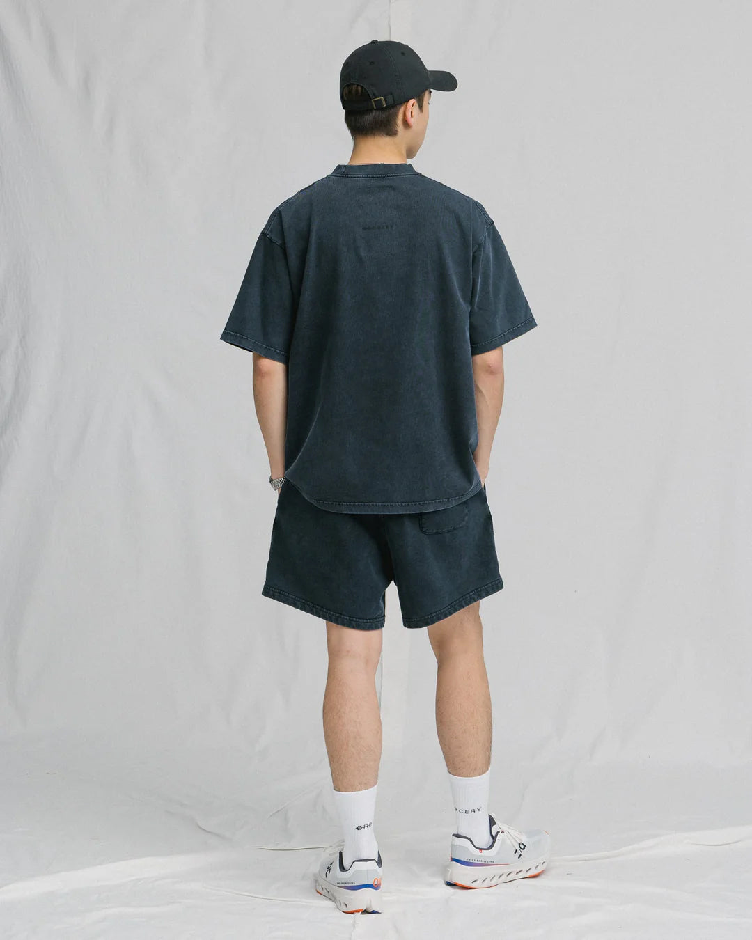 A Eckhaus Latta Shirt pictured on a model in front of a white background. The title of the product is Eckhaus Latta Eclipse Turtleneck - Stone and the image was taken by 199A®.