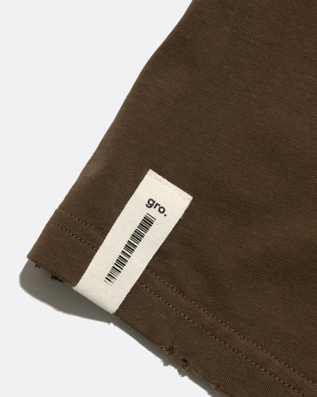 A Eckhaus Latta Shirt pictured on a model in front of a white background. The title of the product is Eckhaus Latta Eclipse Turtleneck - Stone and the image was taken by 199A®.