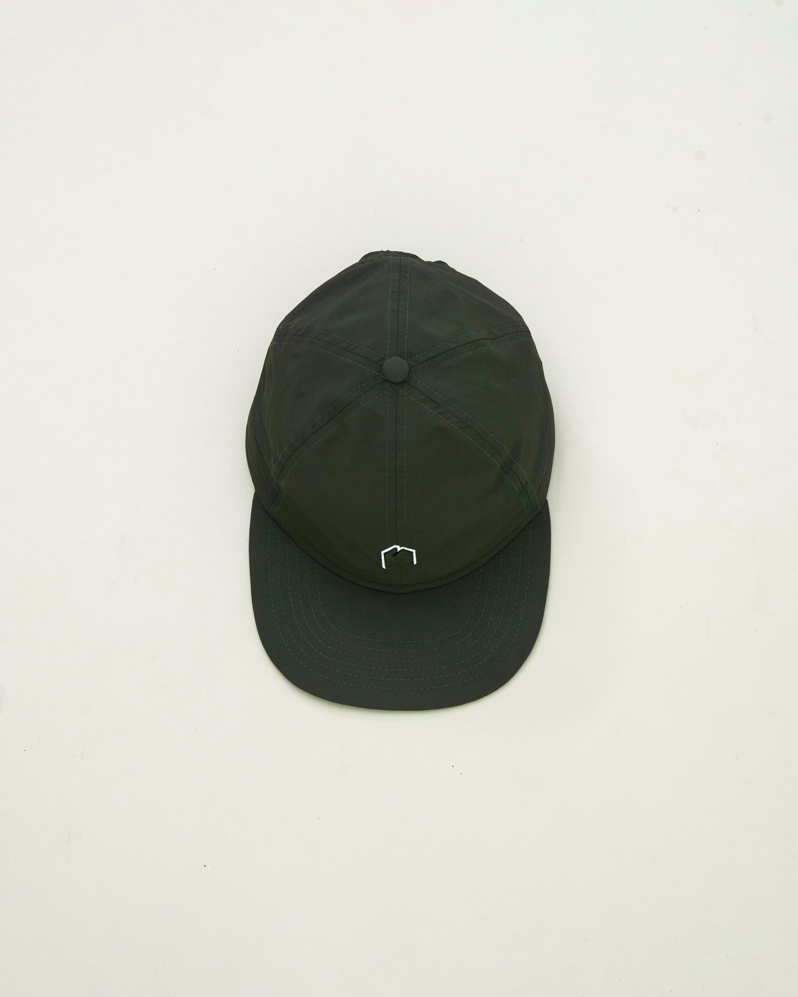 A Eckhaus Latta Shirt pictured on a model in front of a white background. The title of the product is Eckhaus Latta Eclipse Turtleneck - Stone and the image was taken by 199A®.