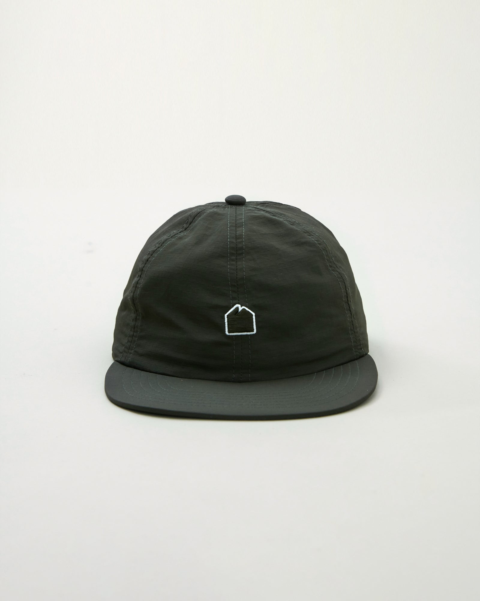 A Eckhaus Latta Shirt pictured on a model in front of a white background. The title of the product is Eckhaus Latta Eclipse Turtleneck - Stone and the image was taken by 199A®.