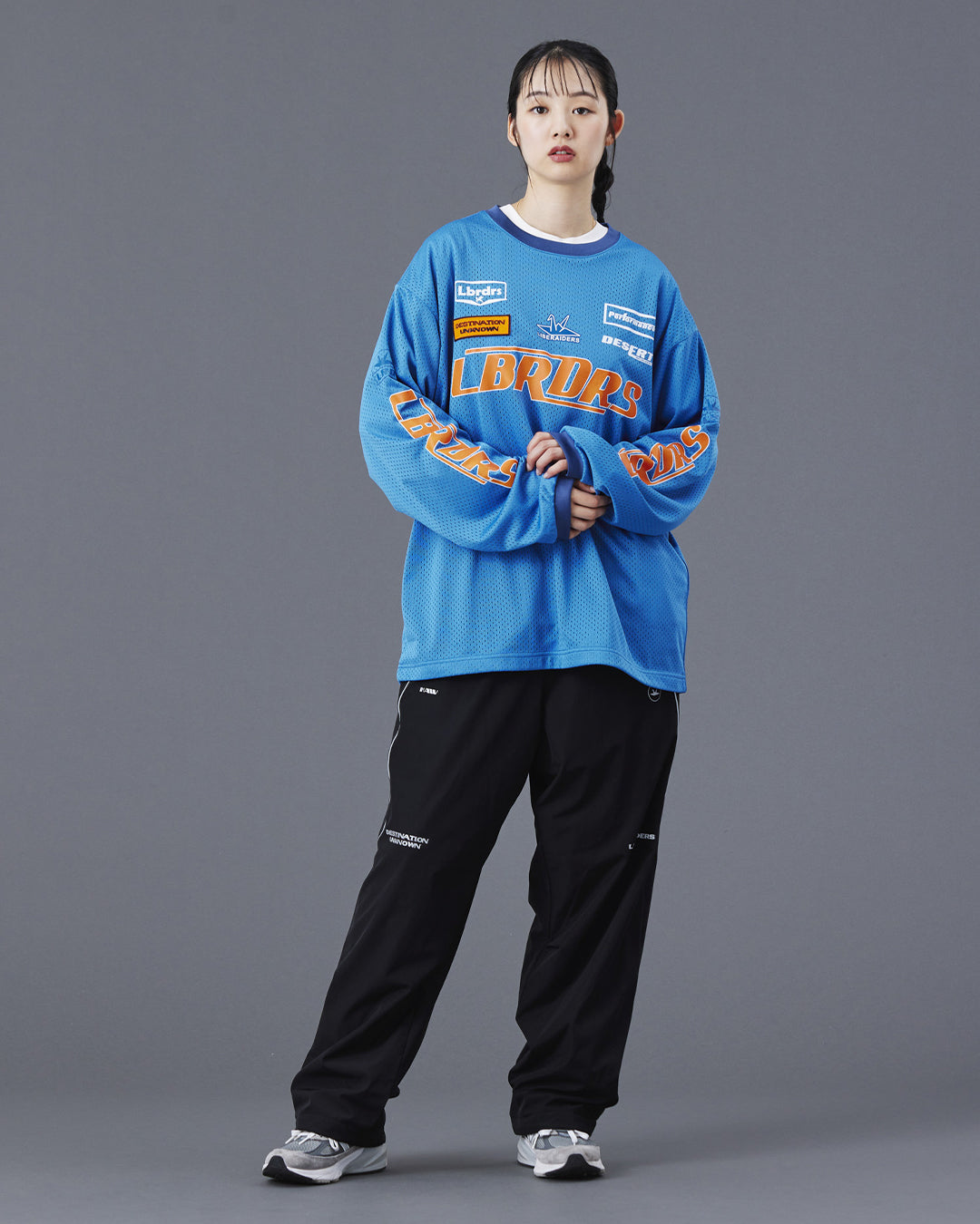 A Eckhaus Latta Shirt pictured on a model in front of a white background. The title of the product is Eckhaus Latta Eclipse Turtleneck - Stone and the image was taken by 199A®.