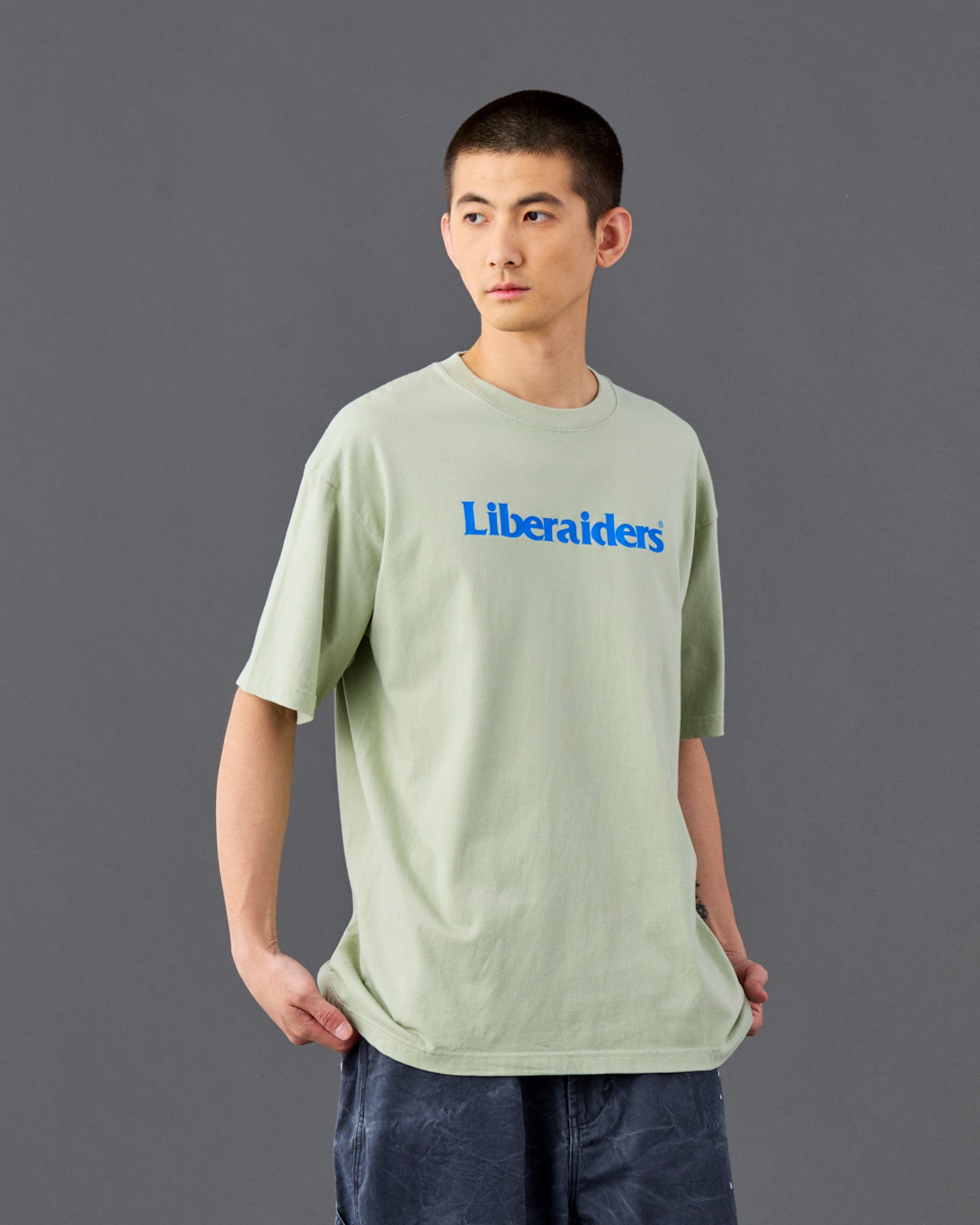 A Eckhaus Latta Shirt pictured on a model in front of a white background. The title of the product is Eckhaus Latta Eclipse Turtleneck - Stone and the image was taken by 199A®.