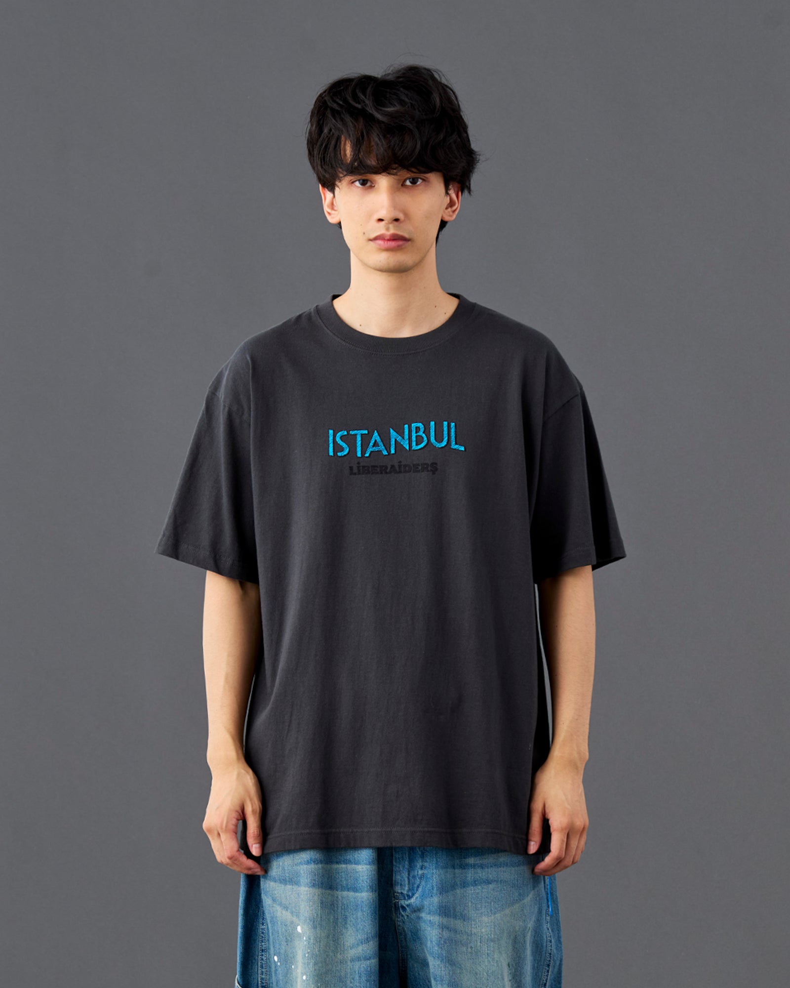 A Eckhaus Latta Shirt pictured on a model in front of a white background. The title of the product is Eckhaus Latta Eclipse Turtleneck - Stone and the image was taken by 199A®.
