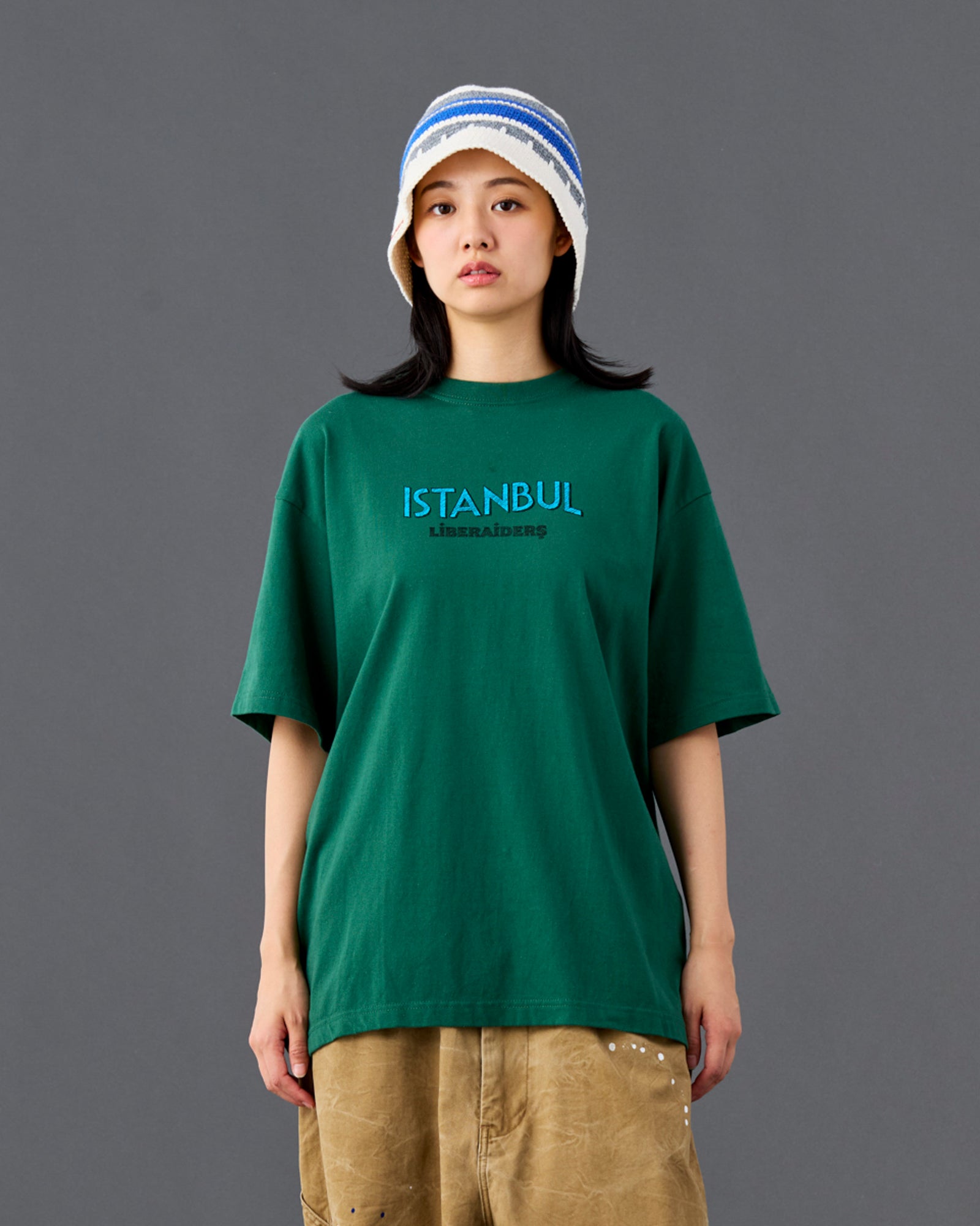 A Eckhaus Latta Shirt pictured on a model in front of a white background. The title of the product is Eckhaus Latta Eclipse Turtleneck - Stone and the image was taken by 199A®.