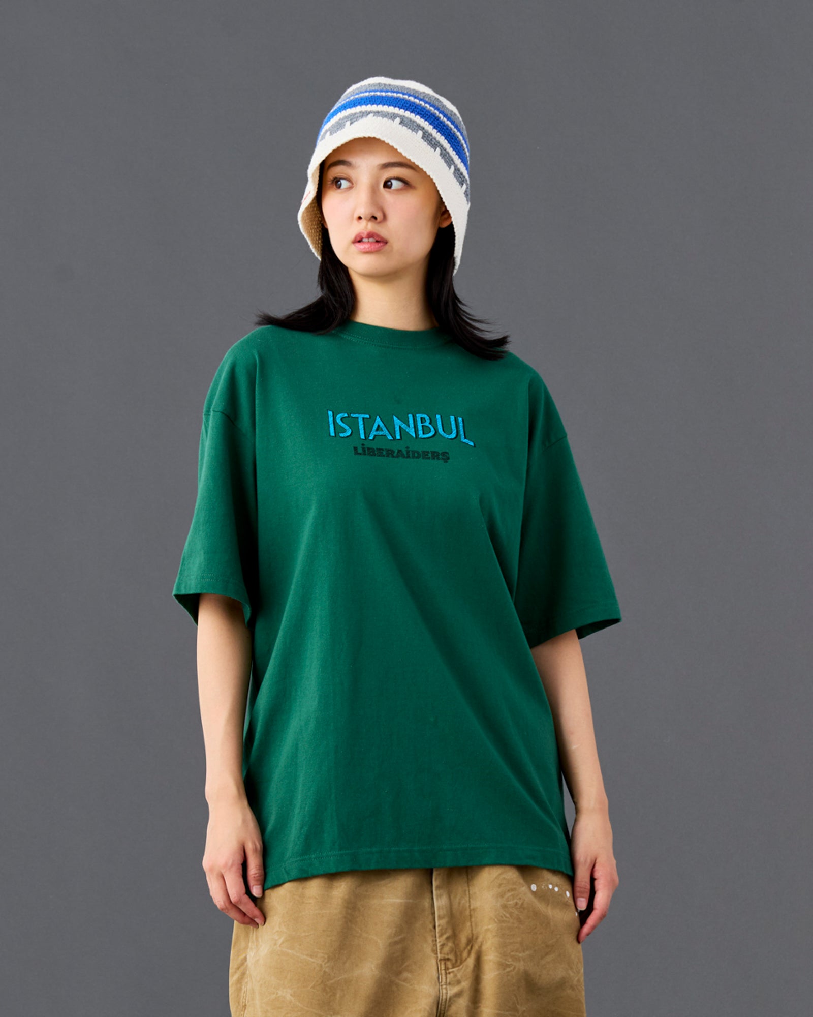 A Eckhaus Latta Shirt pictured on a model in front of a white background. The title of the product is Eckhaus Latta Eclipse Turtleneck - Stone and the image was taken by 199A®.