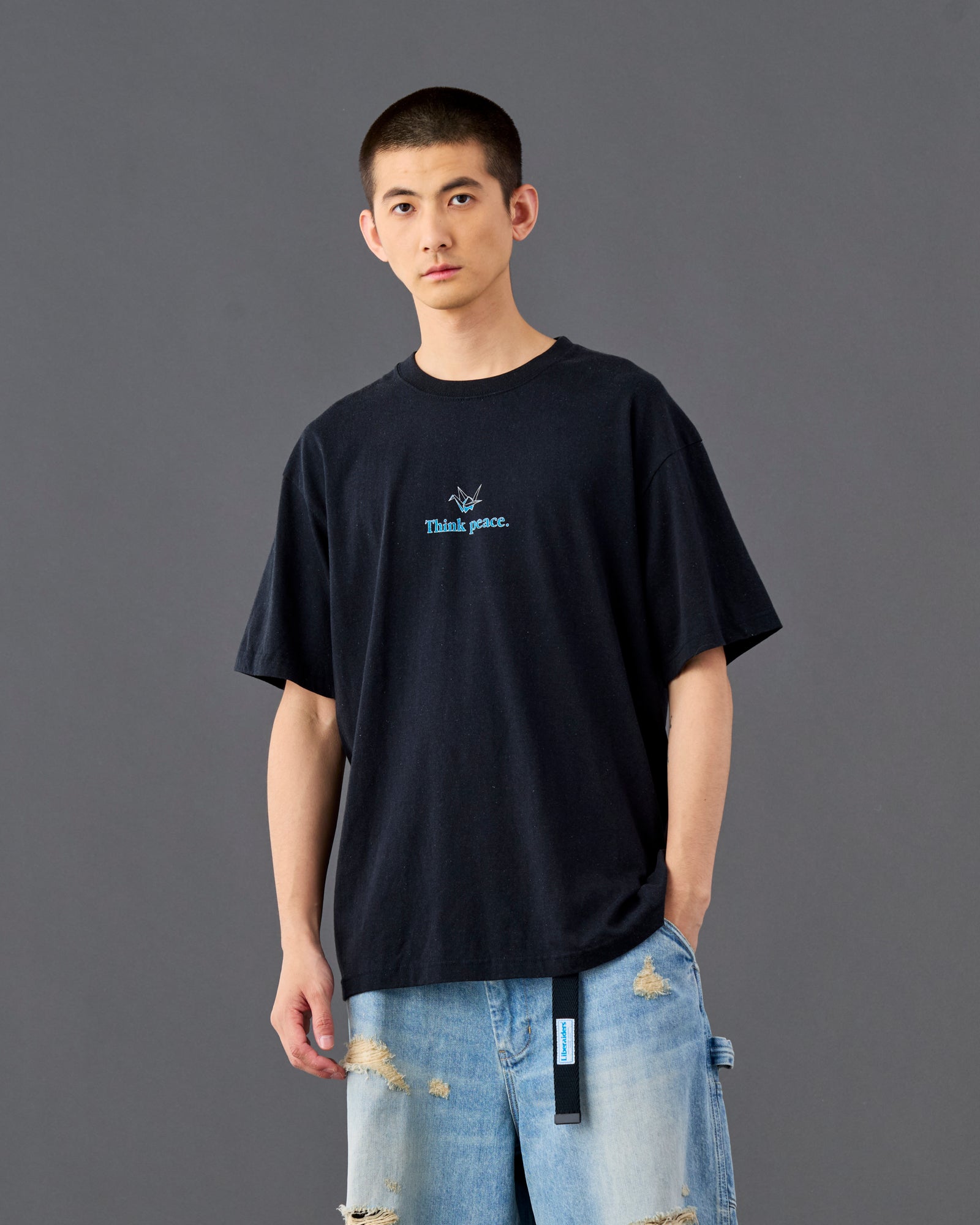 A Eckhaus Latta Shirt pictured on a model in front of a white background. The title of the product is Eckhaus Latta Eclipse Turtleneck - Stone and the image was taken by 199A®.
