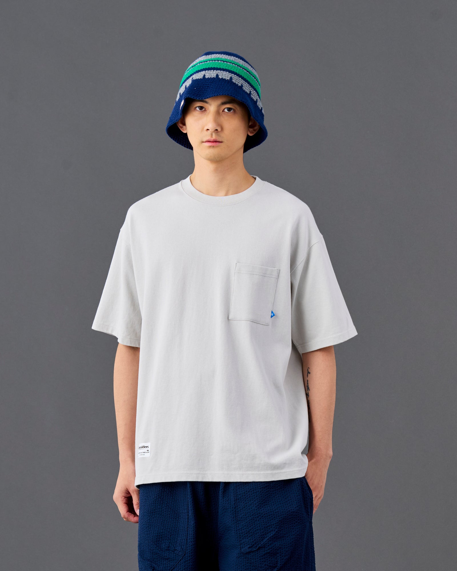 A Eckhaus Latta Shirt pictured on a model in front of a white background. The title of the product is Eckhaus Latta Eclipse Turtleneck - Stone and the image was taken by 199A®.