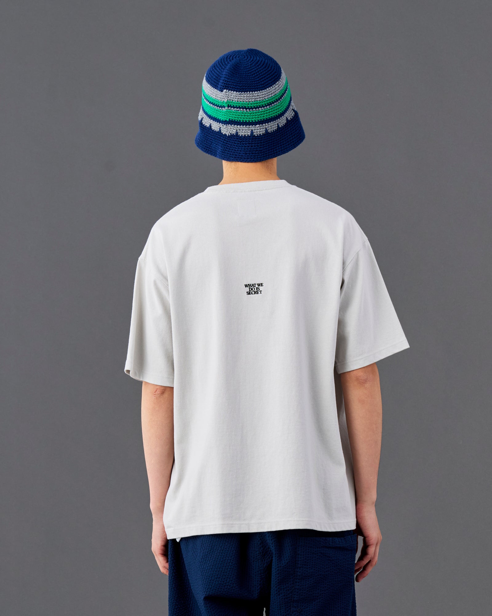 A Eckhaus Latta Shirt pictured on a model in front of a white background. The title of the product is Eckhaus Latta Eclipse Turtleneck - Stone and the image was taken by 199A®.