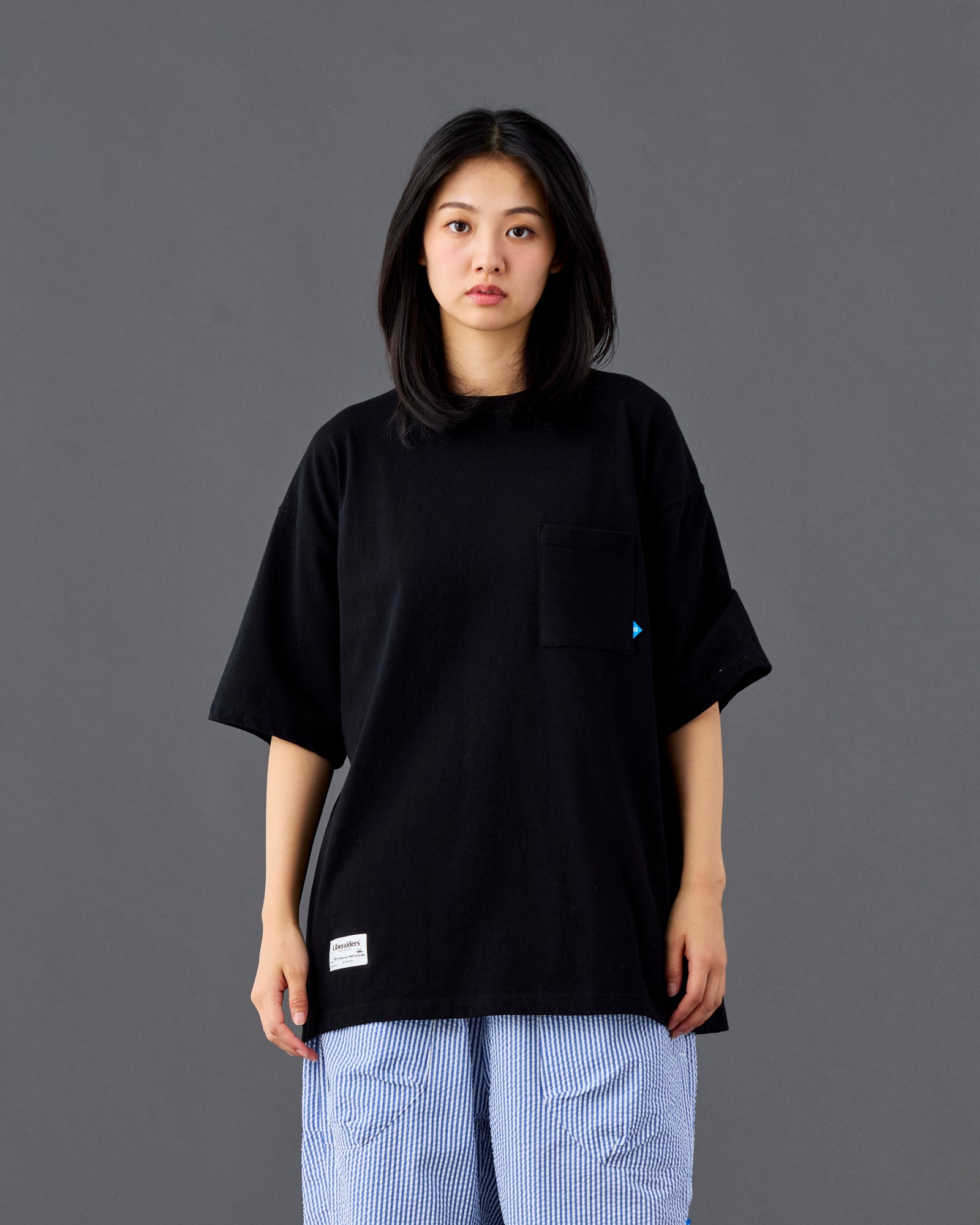 A Eckhaus Latta Shirt pictured on a model in front of a white background. The title of the product is Eckhaus Latta Eclipse Turtleneck - Stone and the image was taken by 199A®.