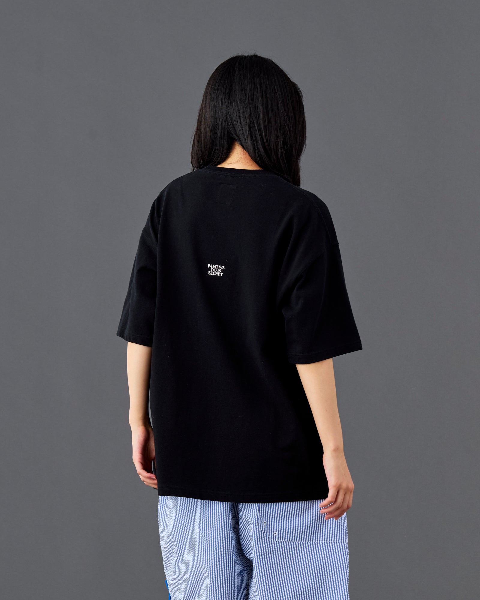 A Eckhaus Latta Shirt pictured on a model in front of a white background. The title of the product is Eckhaus Latta Eclipse Turtleneck - Stone and the image was taken by 199A®.