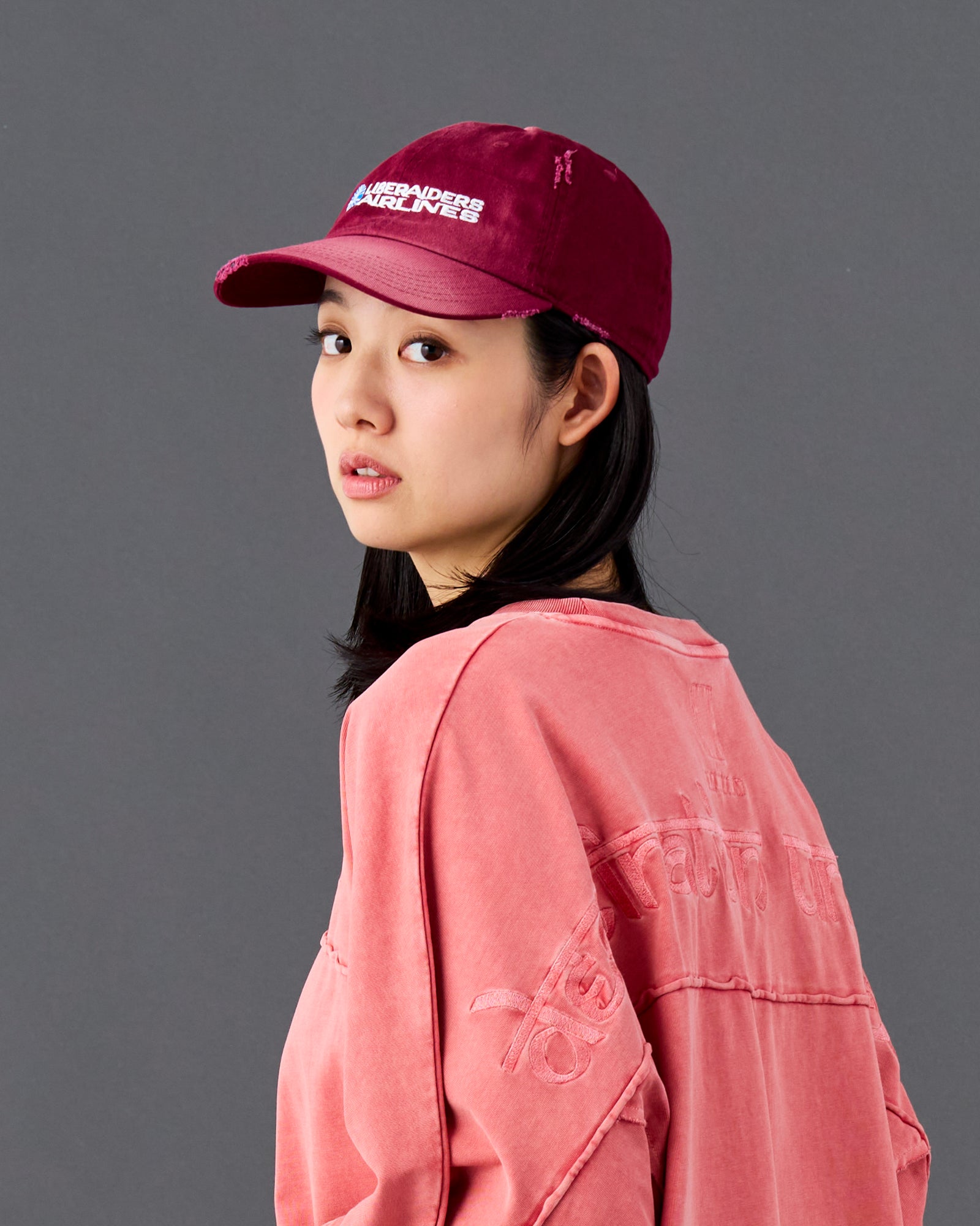 A Eckhaus Latta Shirt pictured on a model in front of a white background. The title of the product is Eckhaus Latta Eclipse Turtleneck - Stone and the image was taken by 199A®.